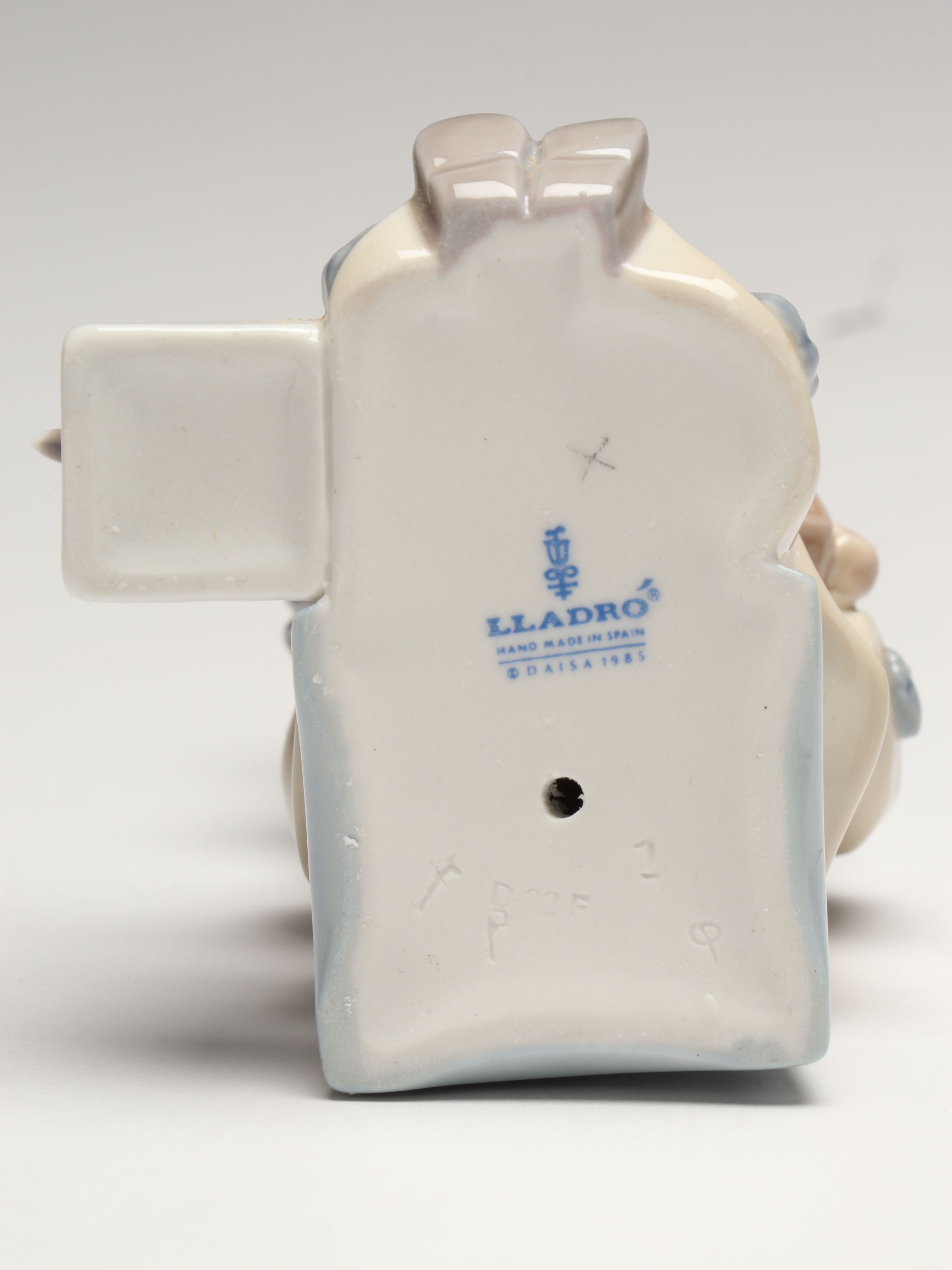 Lladró Clown with Puppy Porcelain Figures and Other Swaddled Baby Figure