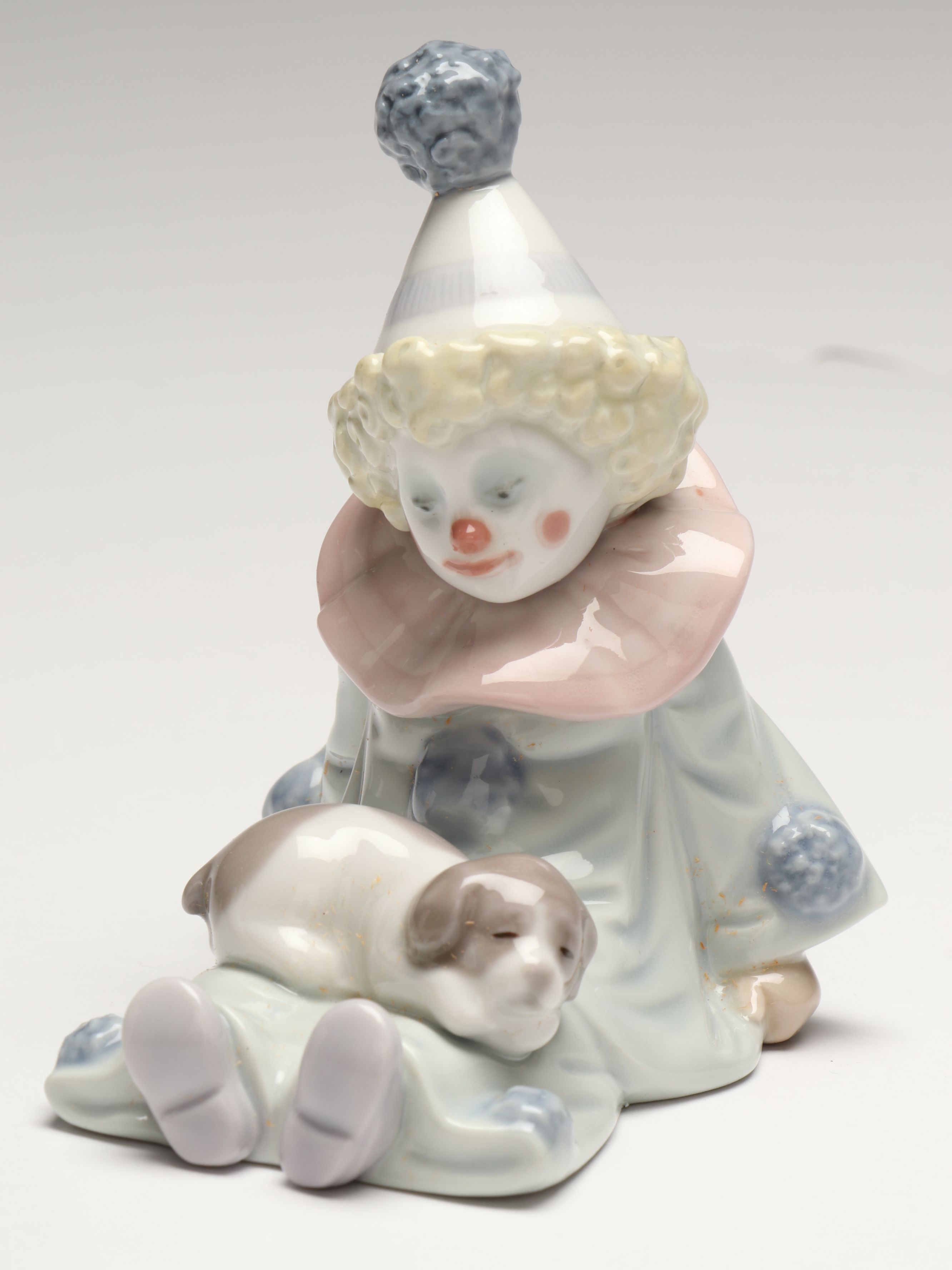 Lladró Clown with Puppy Porcelain Figures and Other Swaddled Baby Figure