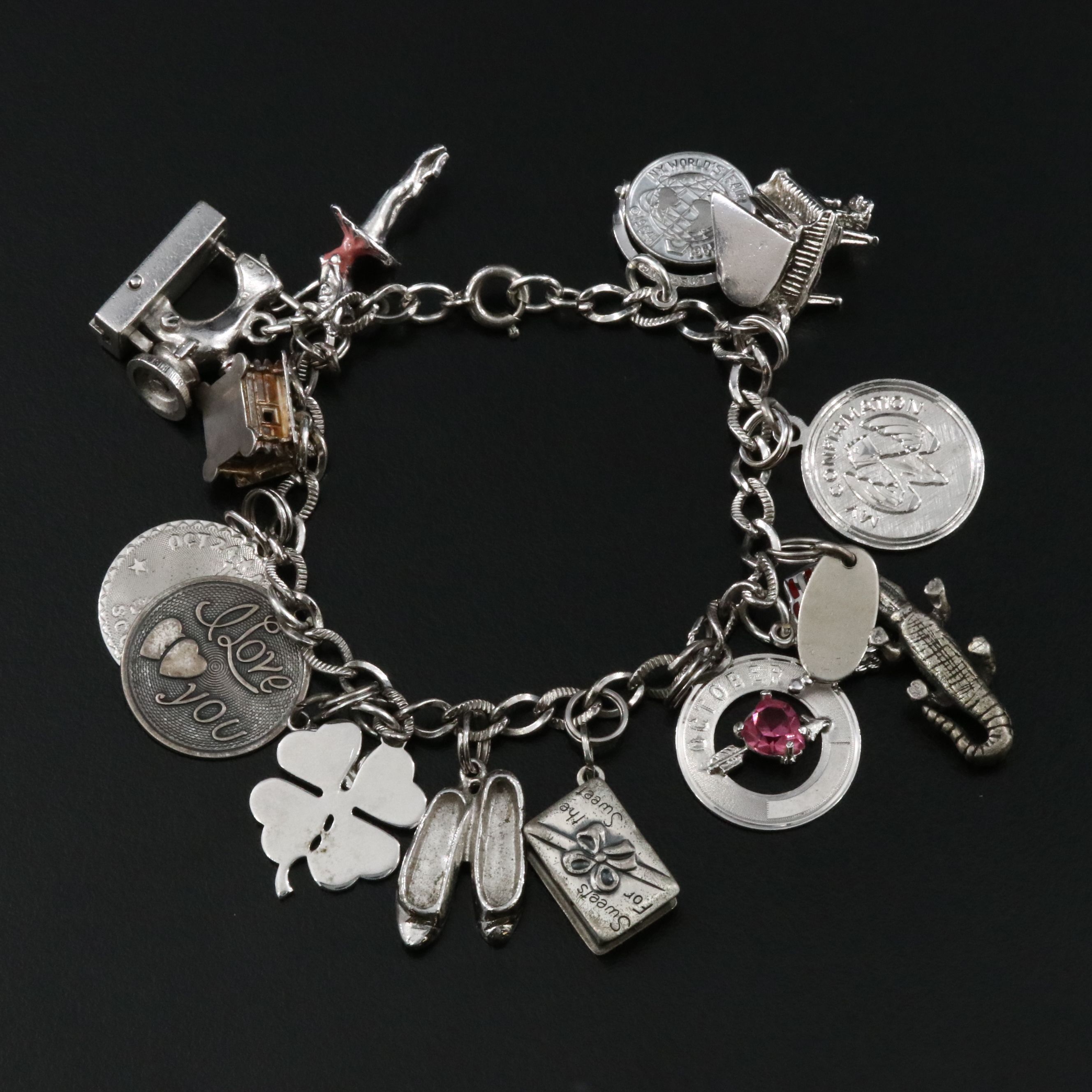Vintage Sterling Charm Bracelet Featuring Articulated Charms