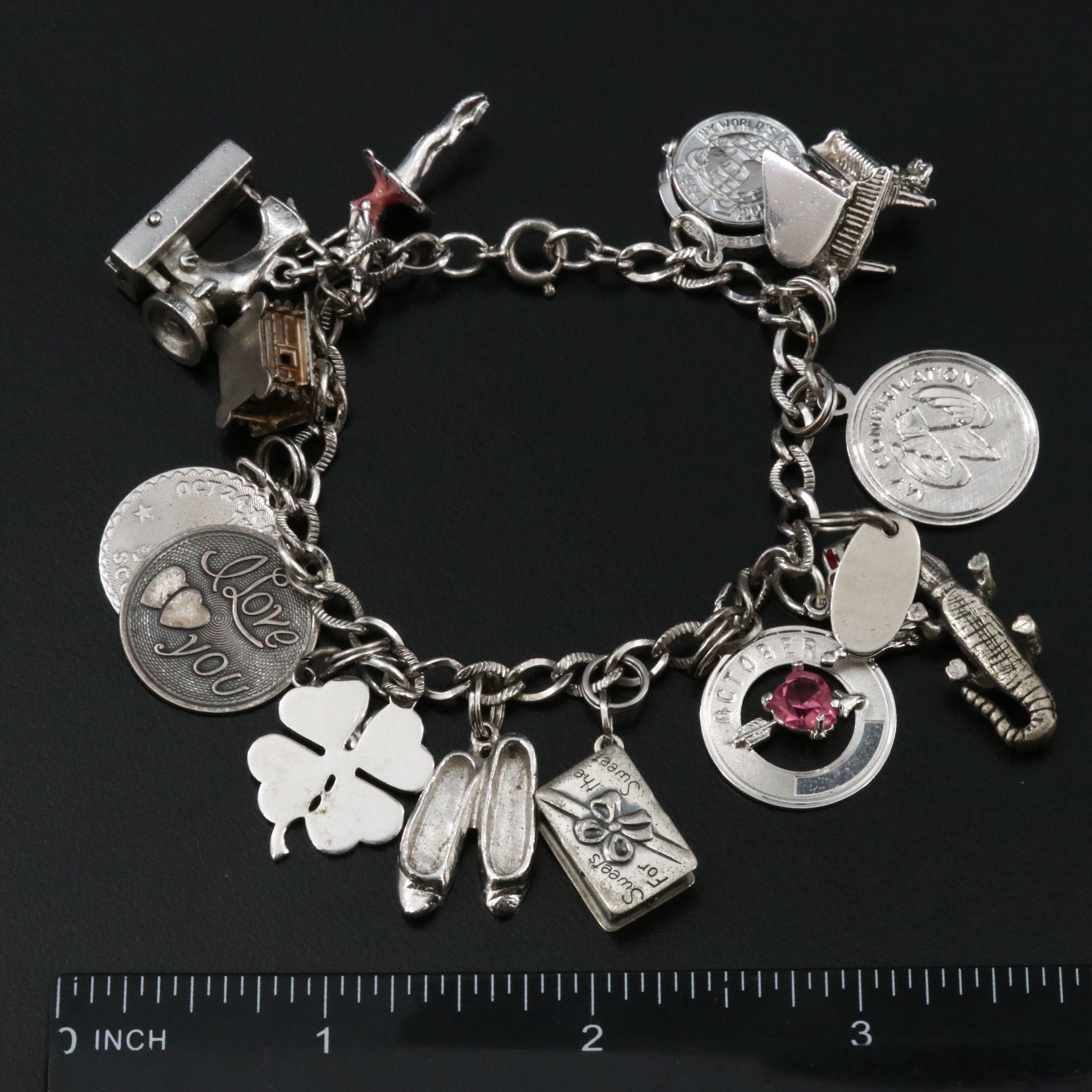 Vintage Sterling Charm Bracelet Featuring Articulated Charms