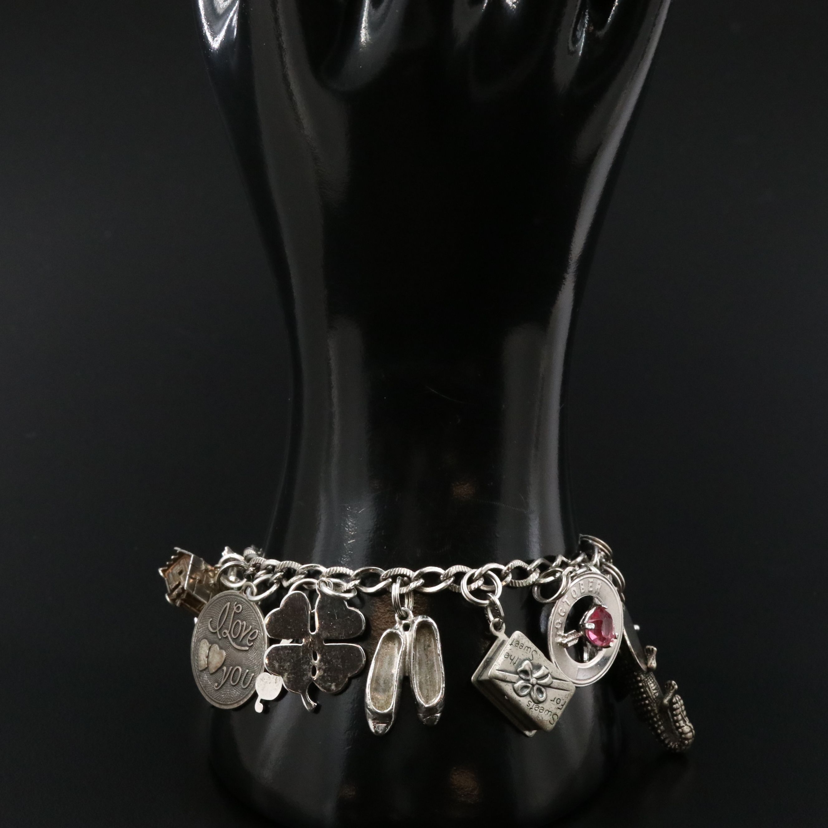 Vintage Sterling Charm Bracelet Featuring Articulated Charms