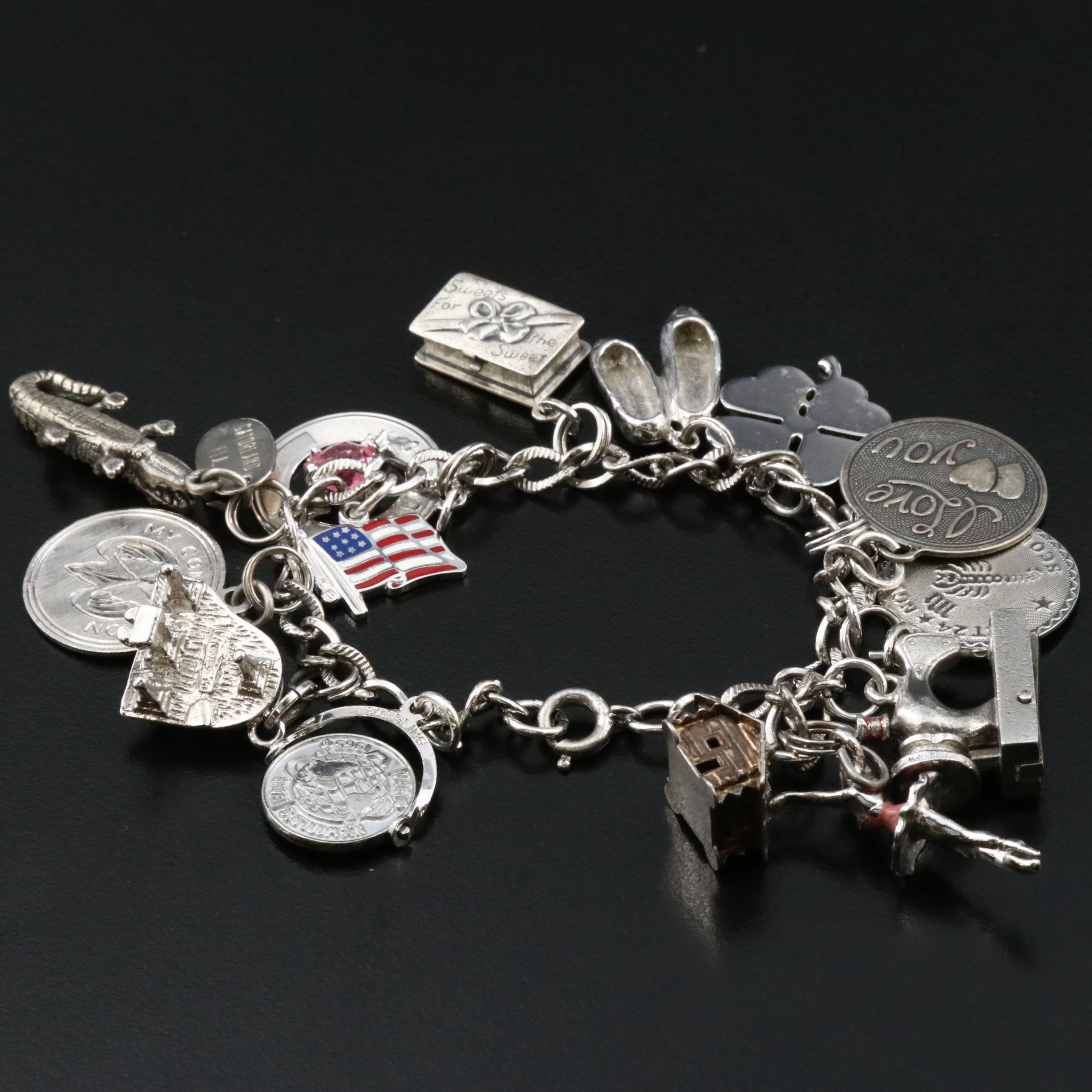 Vintage Sterling Charm Bracelet Featuring Articulated Charms