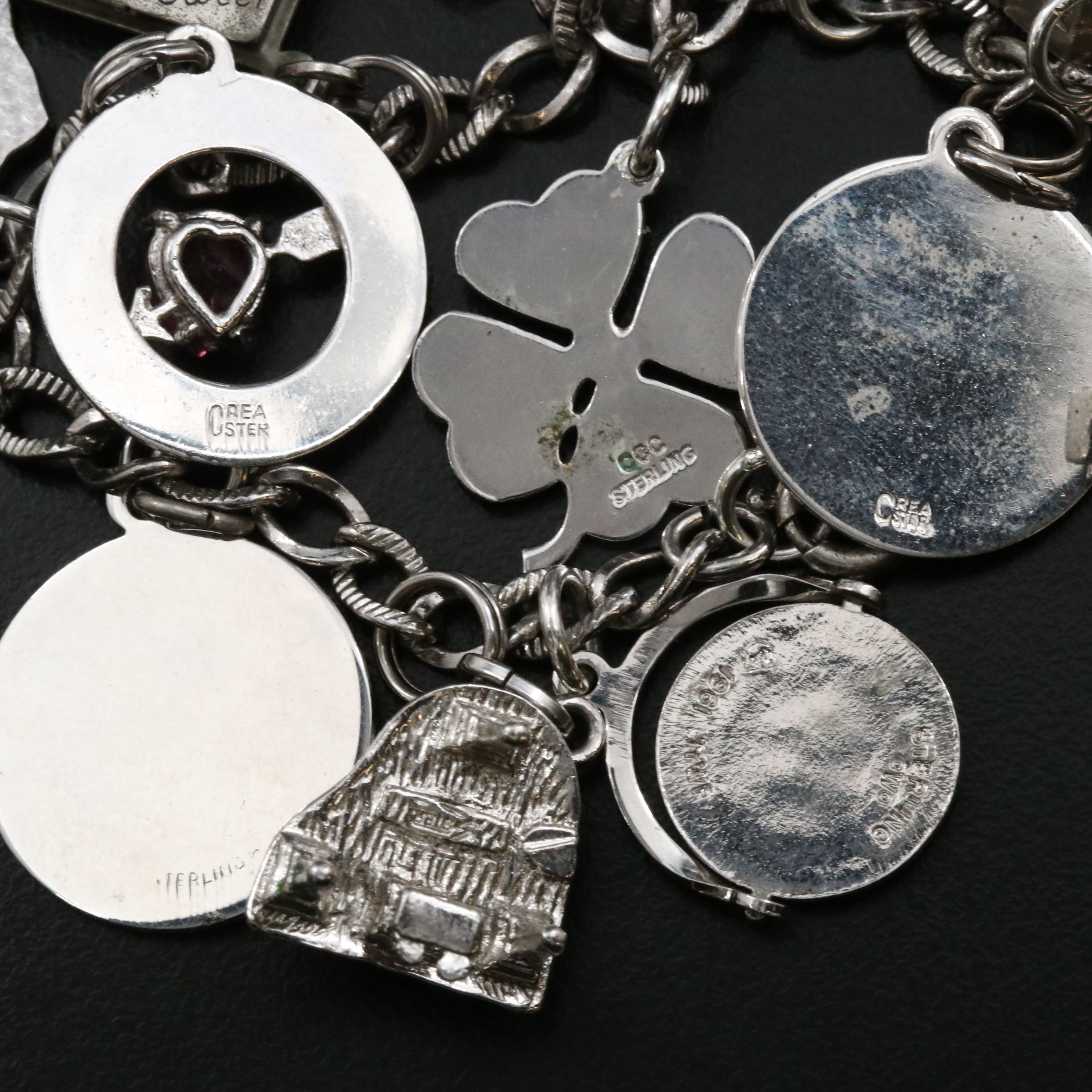 Vintage Sterling Charm Bracelet Featuring Articulated Charms