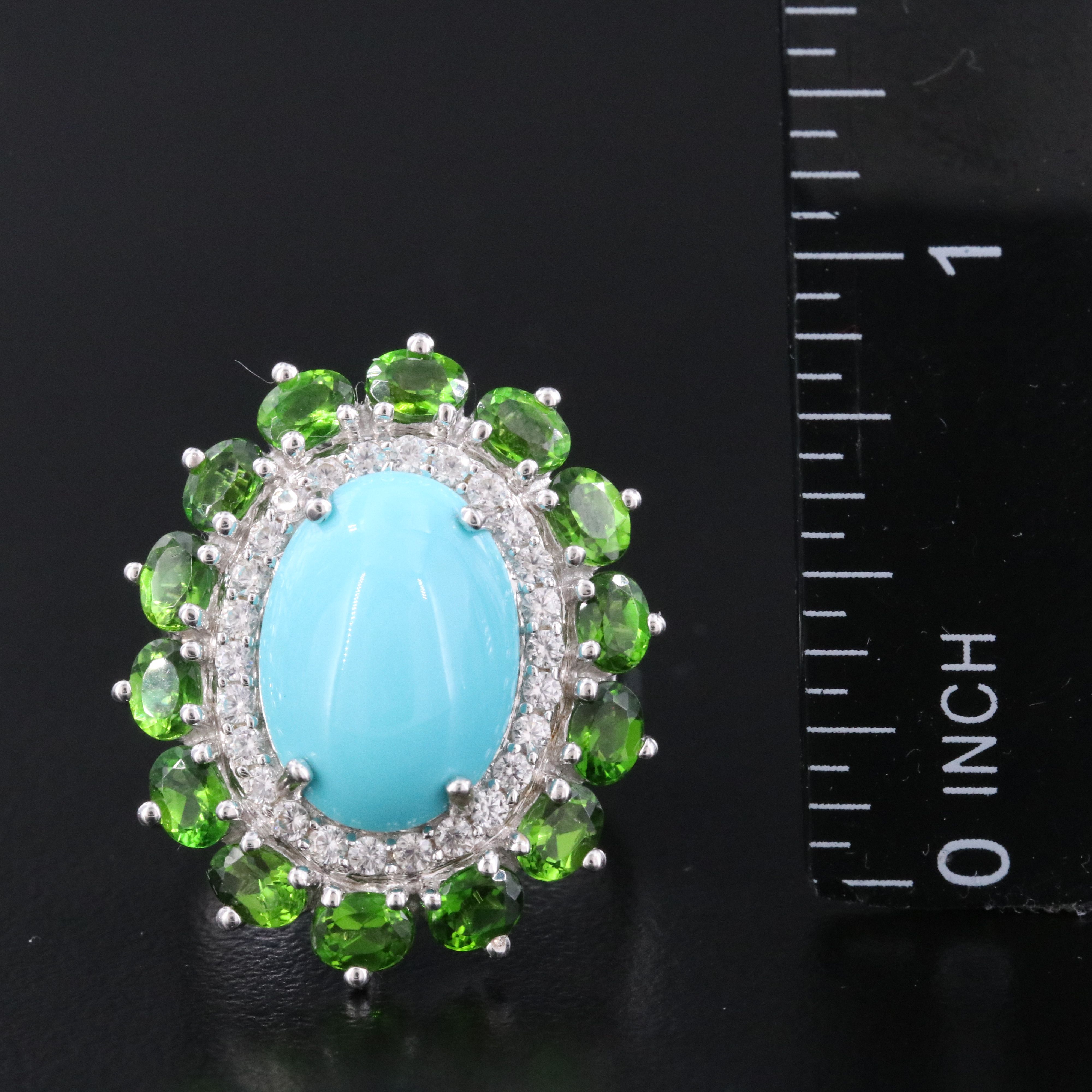 Sterling Turquoise, White Topaz, and Garnet Halo Ring