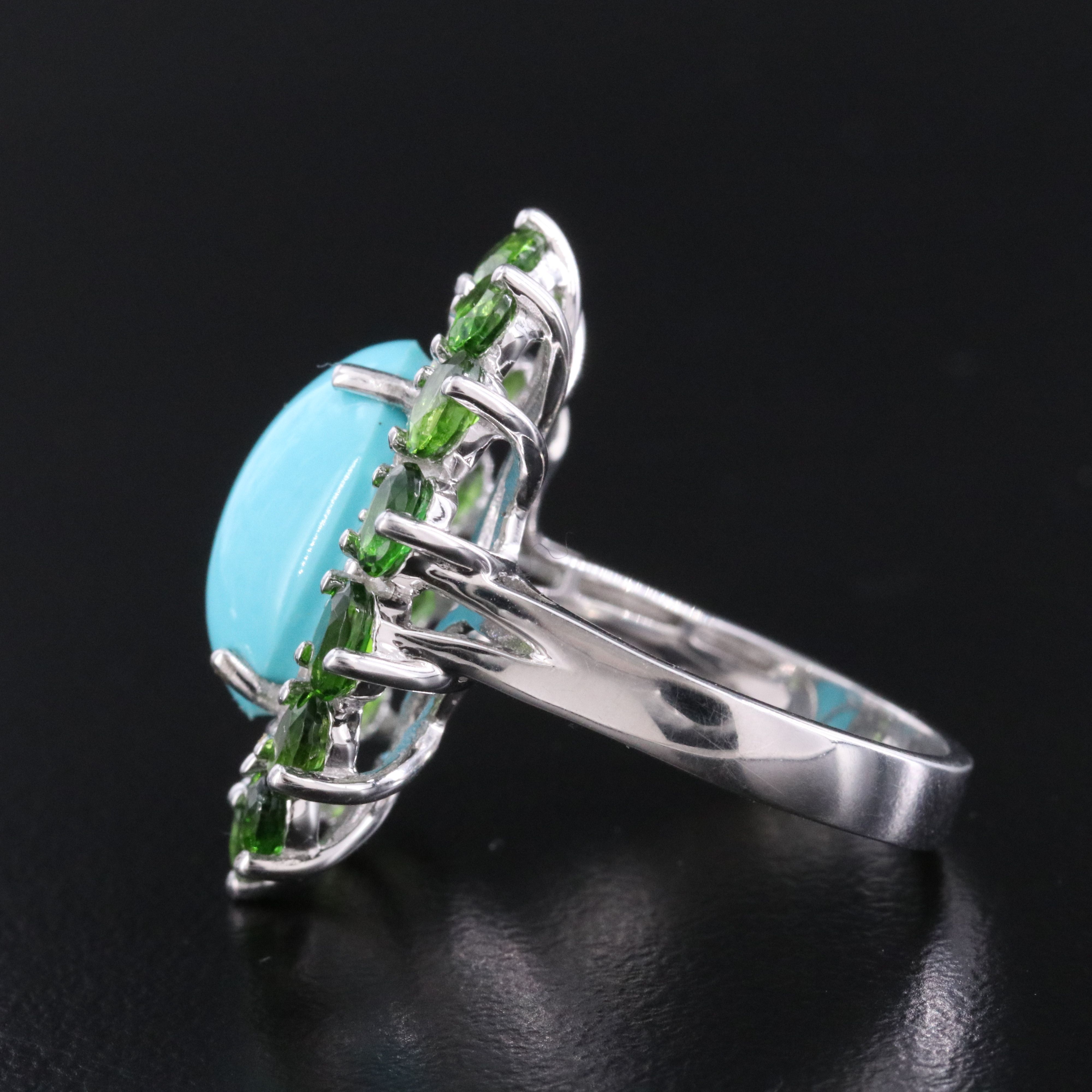 Sterling Turquoise, White Topaz, and Garnet Halo Ring