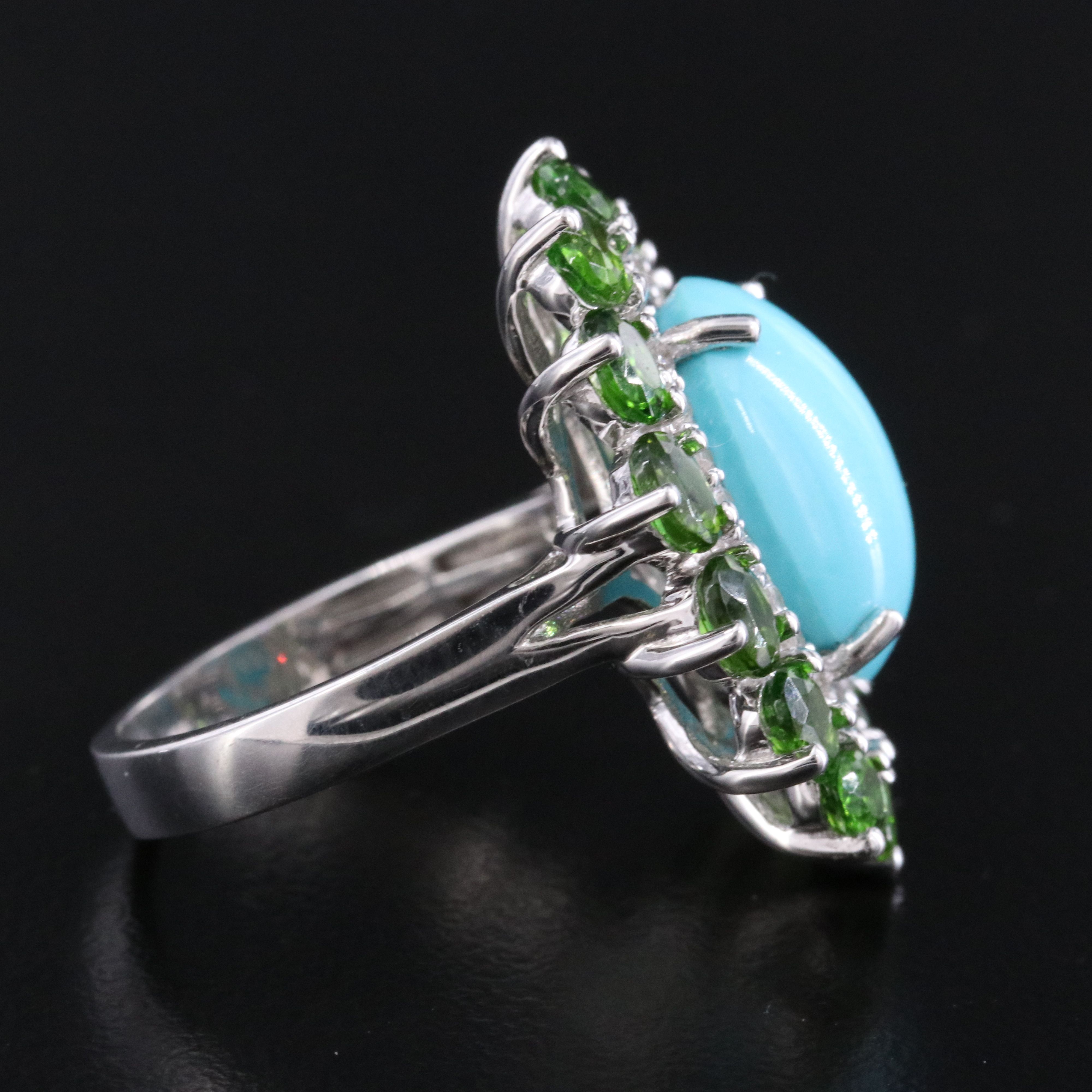 Sterling Turquoise, White Topaz, and Garnet Halo Ring