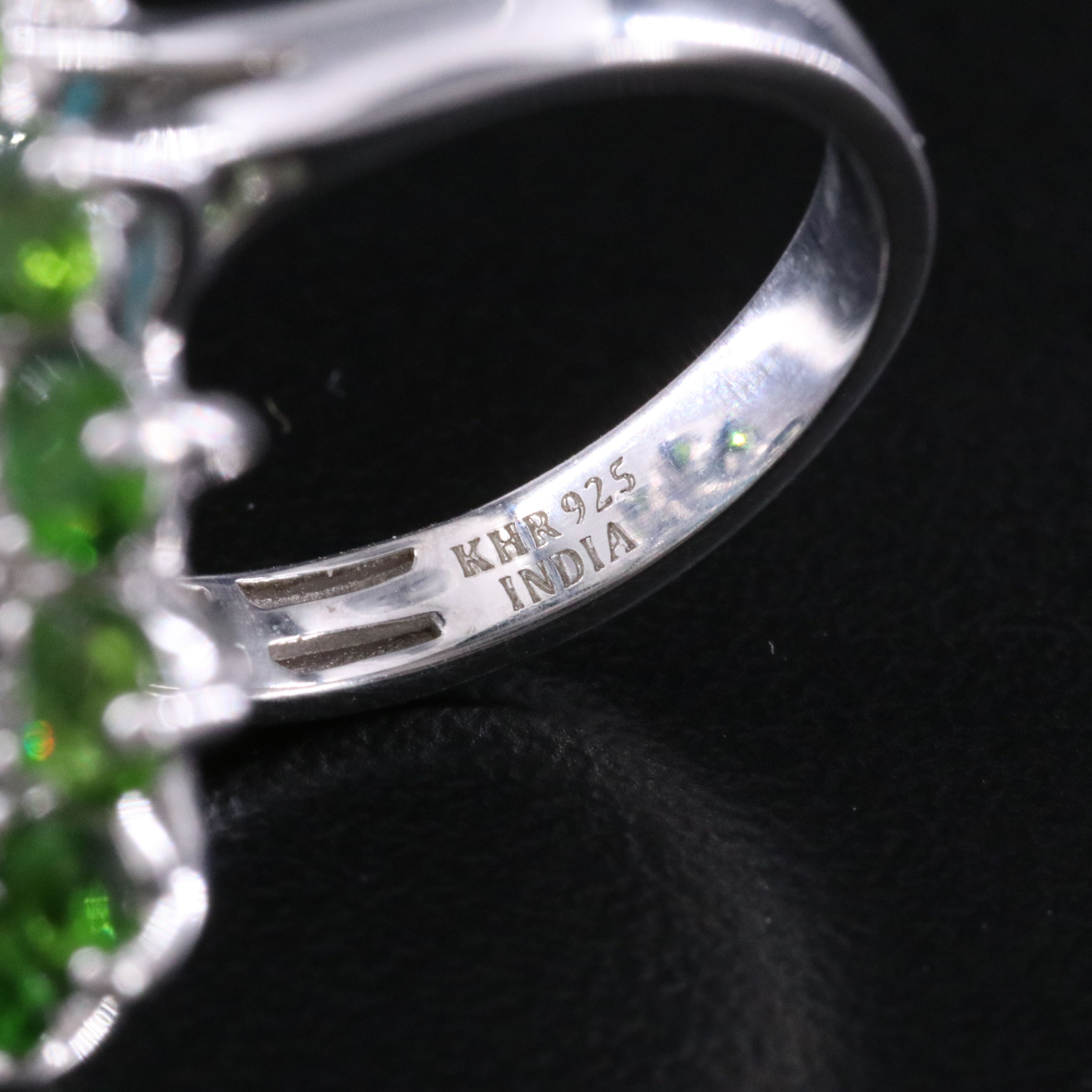 Sterling Turquoise, White Topaz, and Garnet Halo Ring