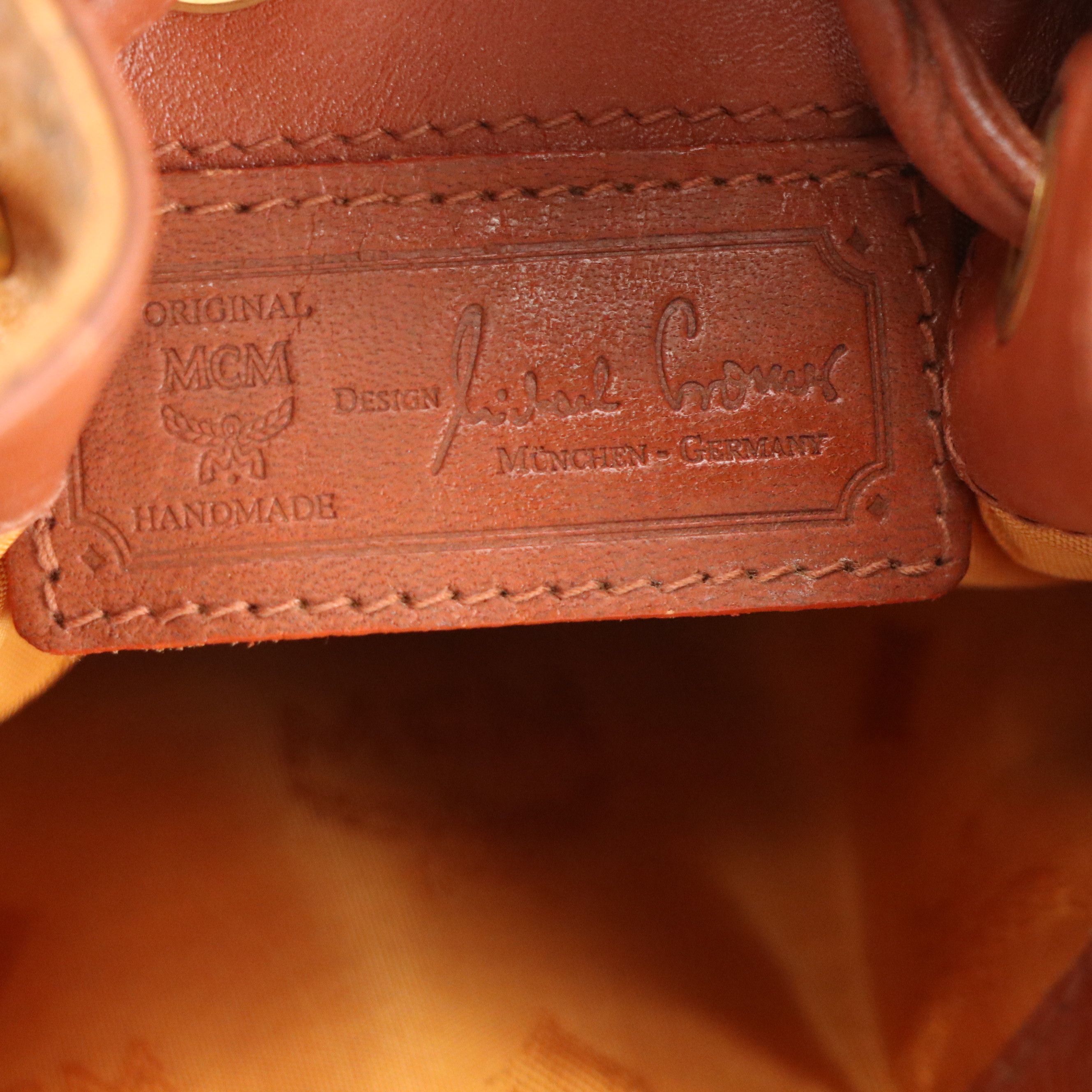 MCM Mini Drawstring Bucket Bag in Cognac Visetos Canvas