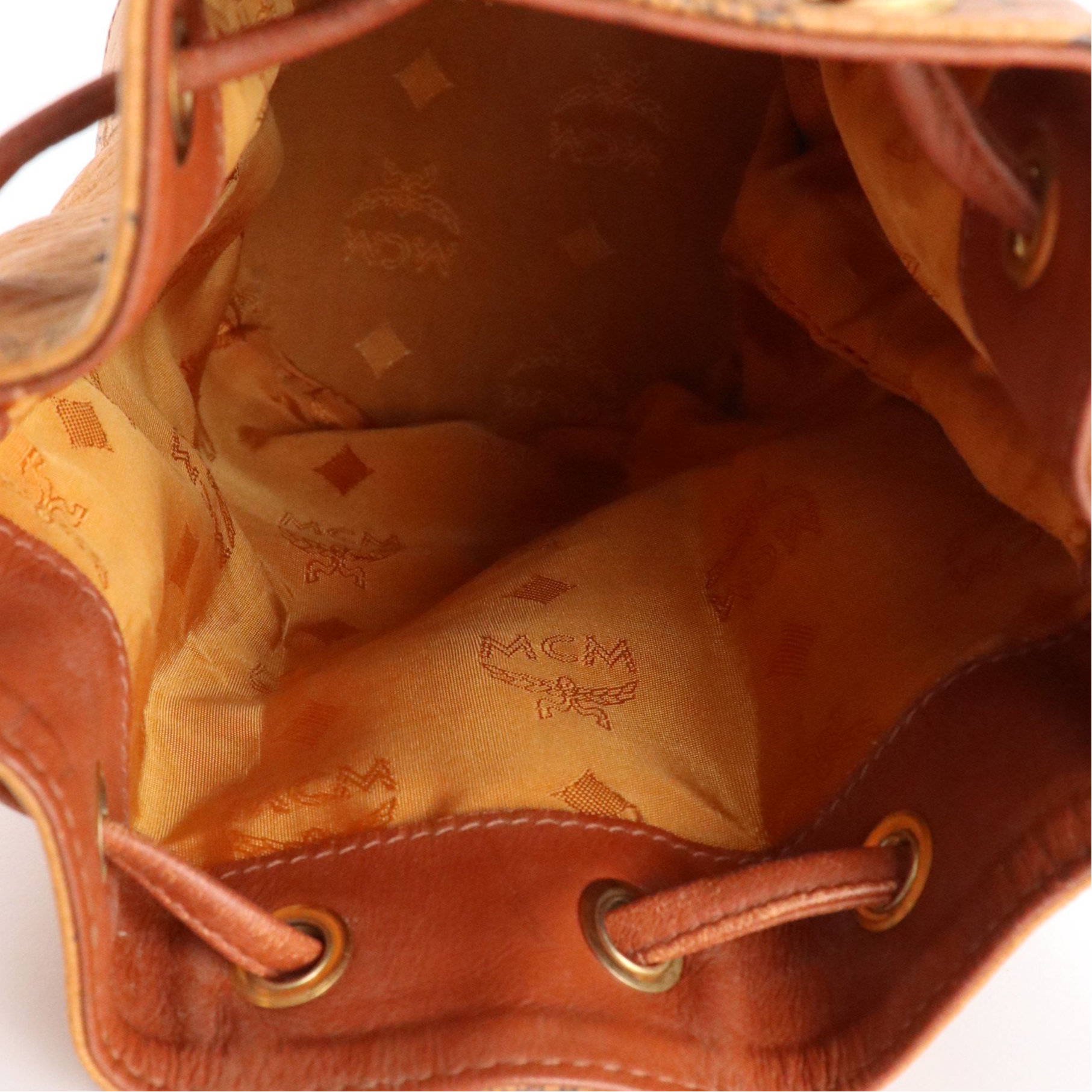 MCM Mini Drawstring Bucket Bag in Cognac Visetos Canvas