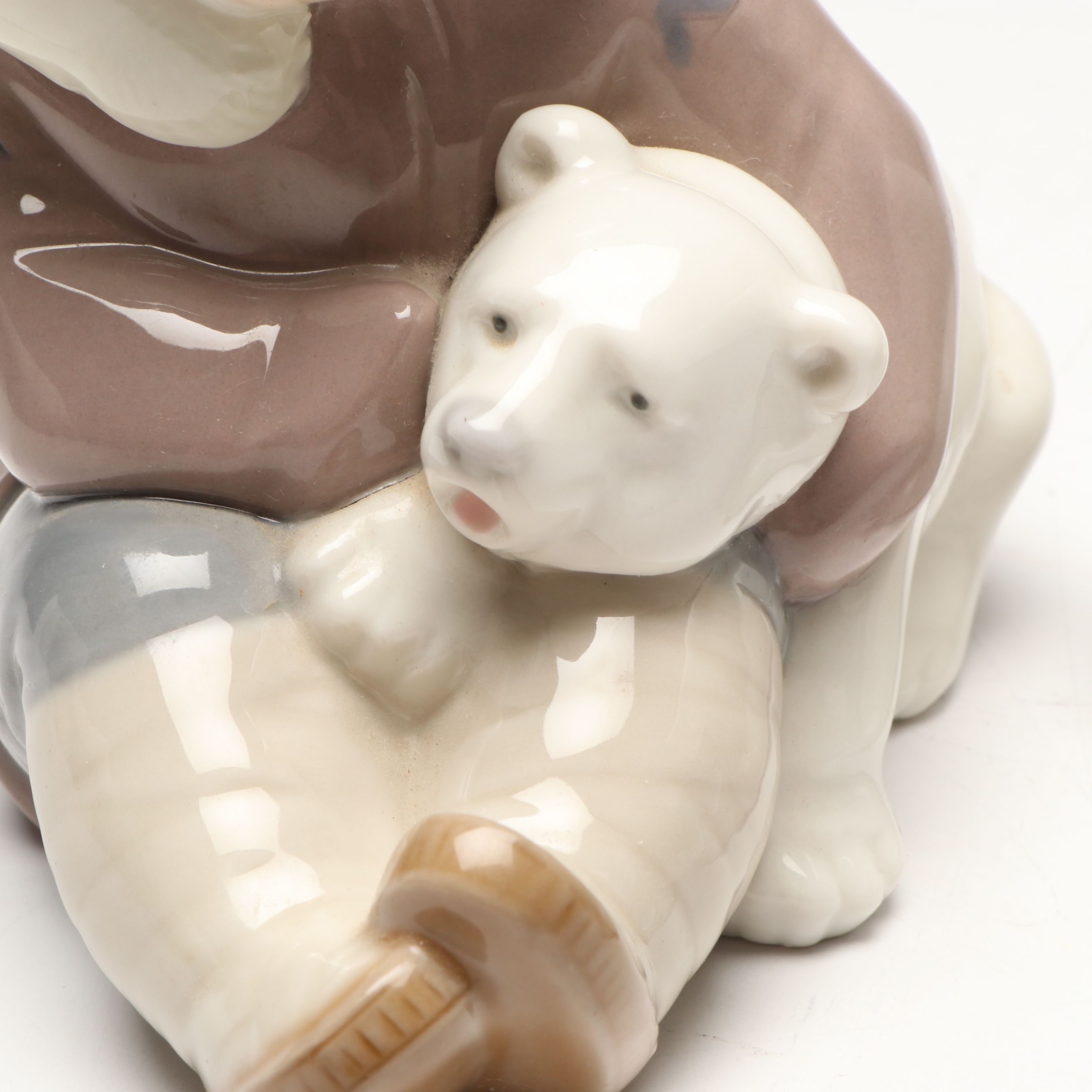 Lladró Inuit and "Seated Polar Bear" Porcelain Figurines