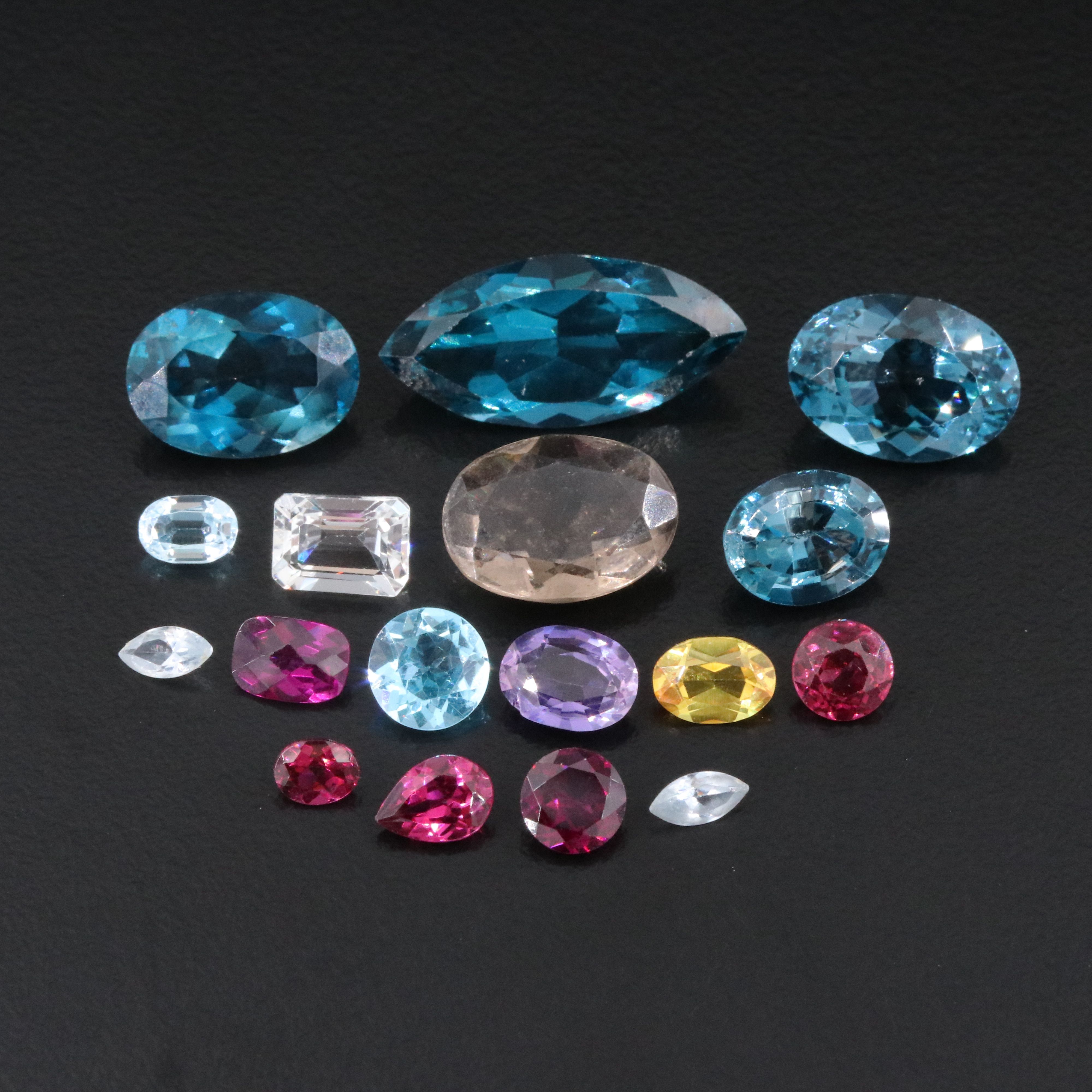 Loose 46.04 CTW Gemstone Lot Including Topaz, Garnet and Lab Grown Sapphire