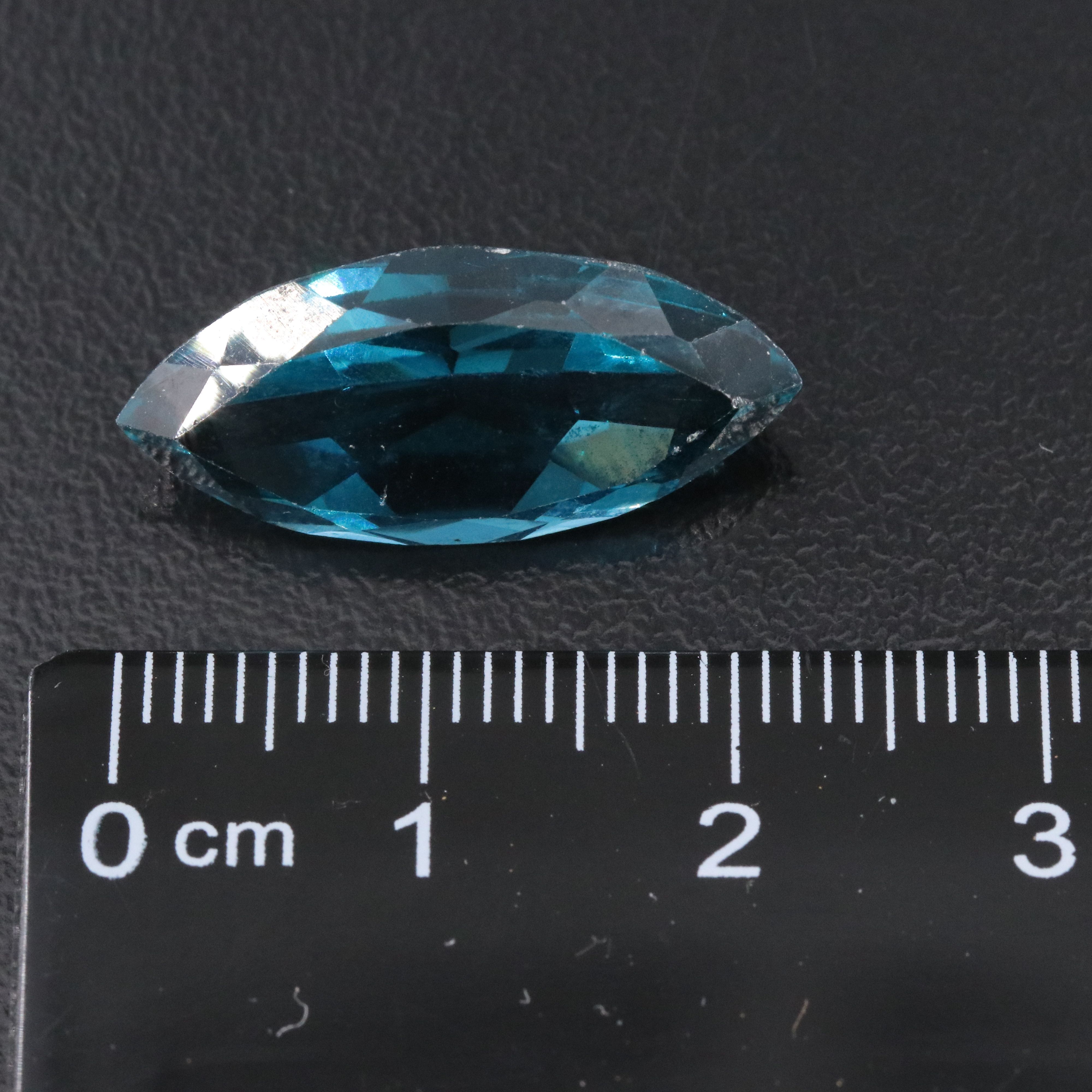 Loose 46.04 CTW Gemstone Lot Including Topaz, Garnet and Lab Grown Sapphire