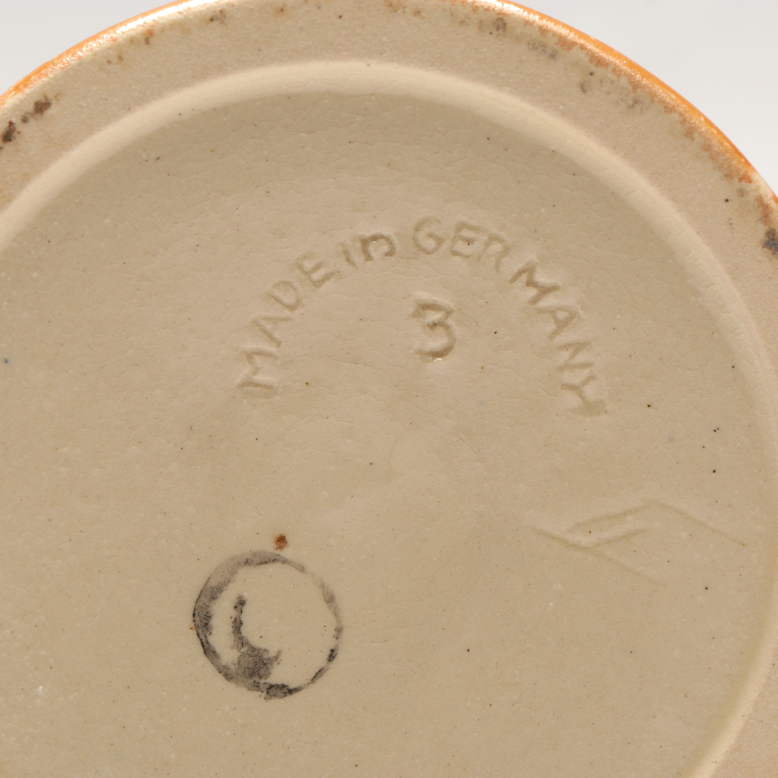 Pair of German Embossed Provincial Scene Steins