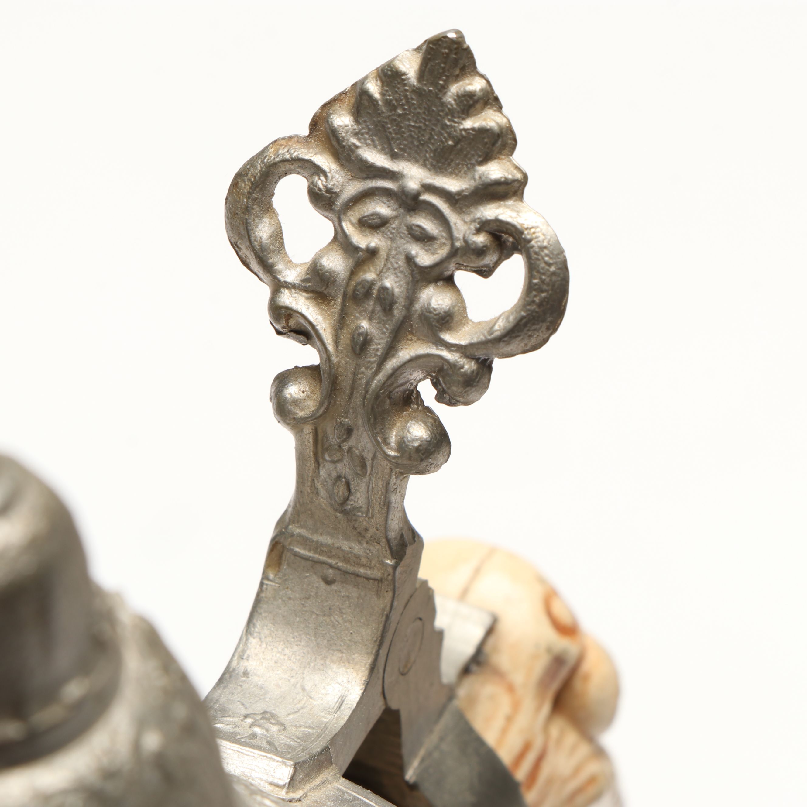 Pair of German Embossed Provincial Scene Steins