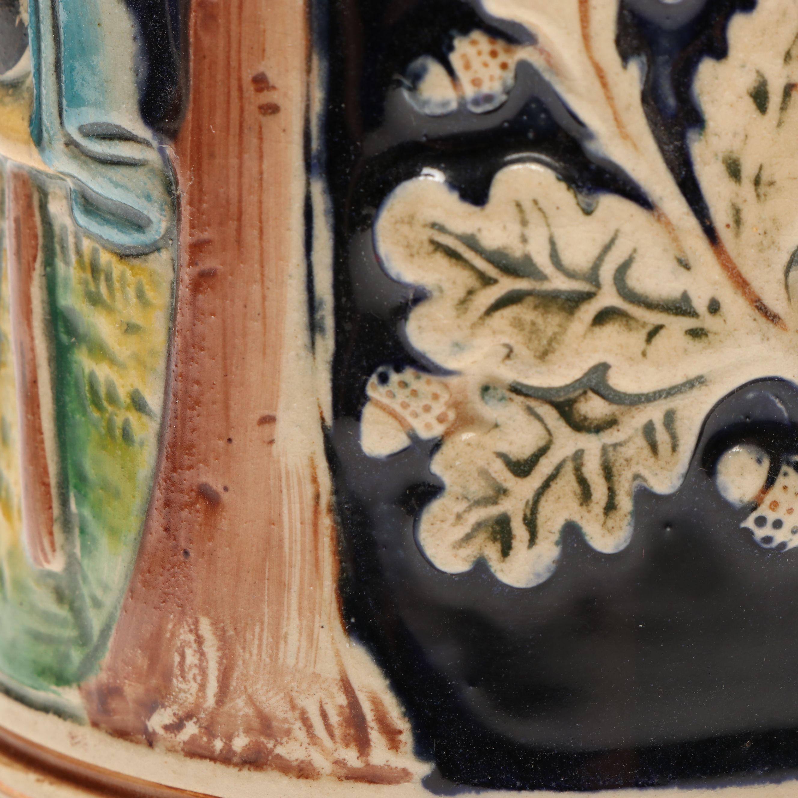 Pair of German Embossed Provincial Scene Steins