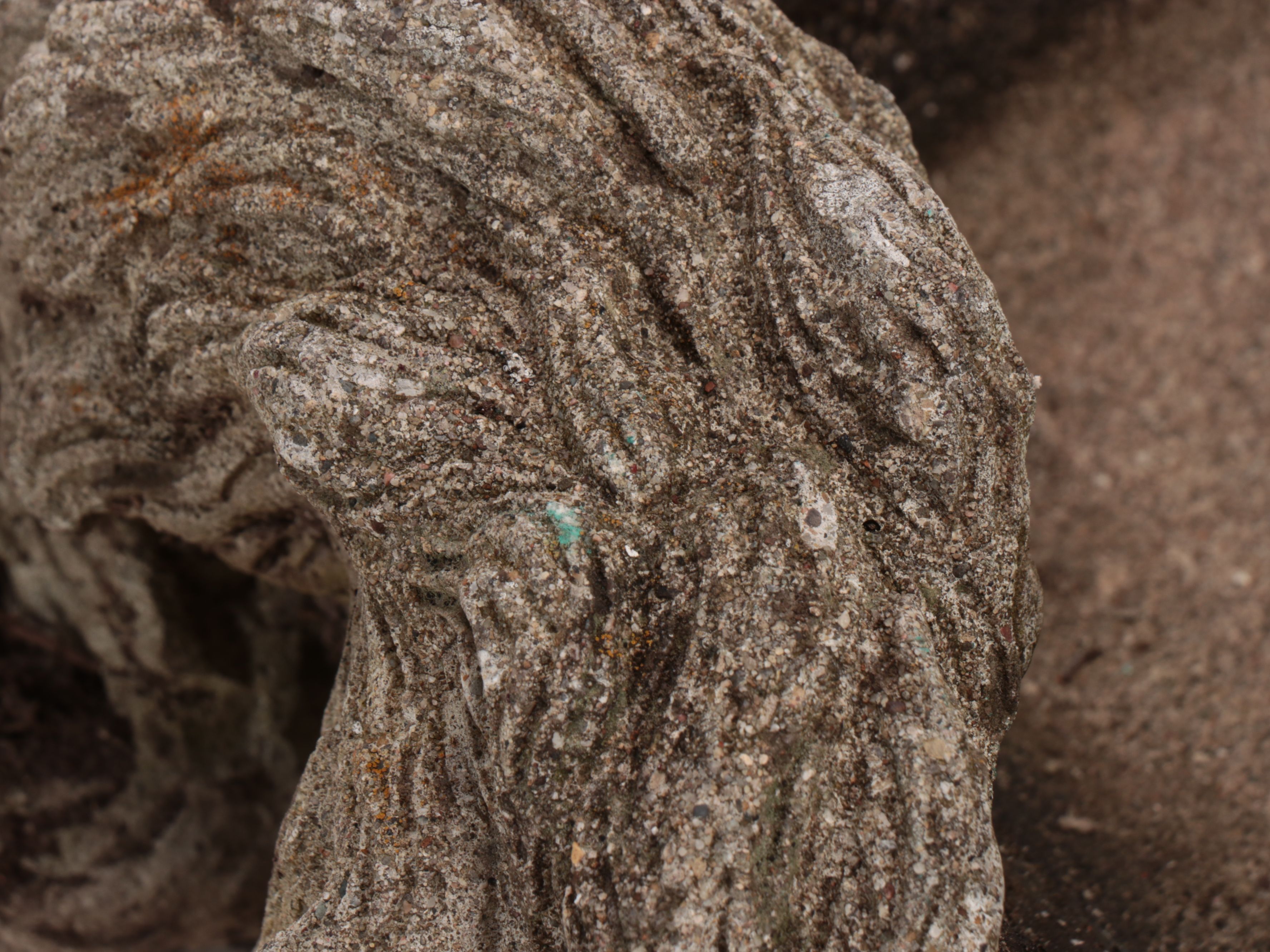 Weathered Cat Lying on Back Stone Garden Planter