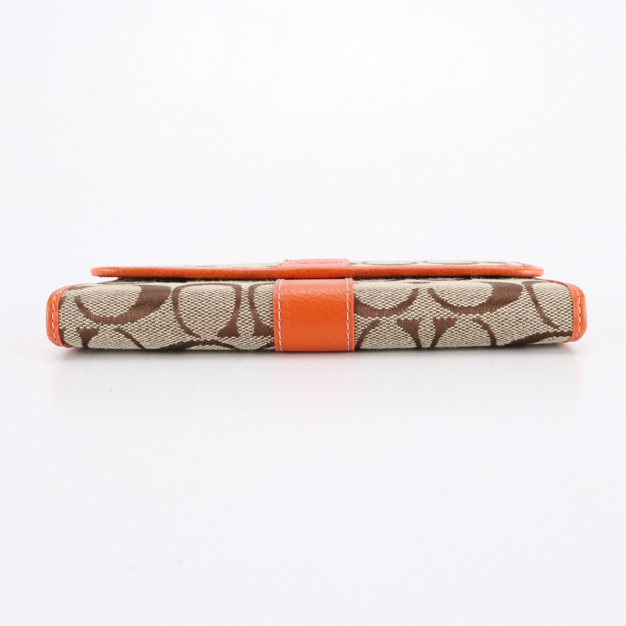 Dooney & Bourke Flap Wristlet with Coach Signature Stripe Clutch Wallets