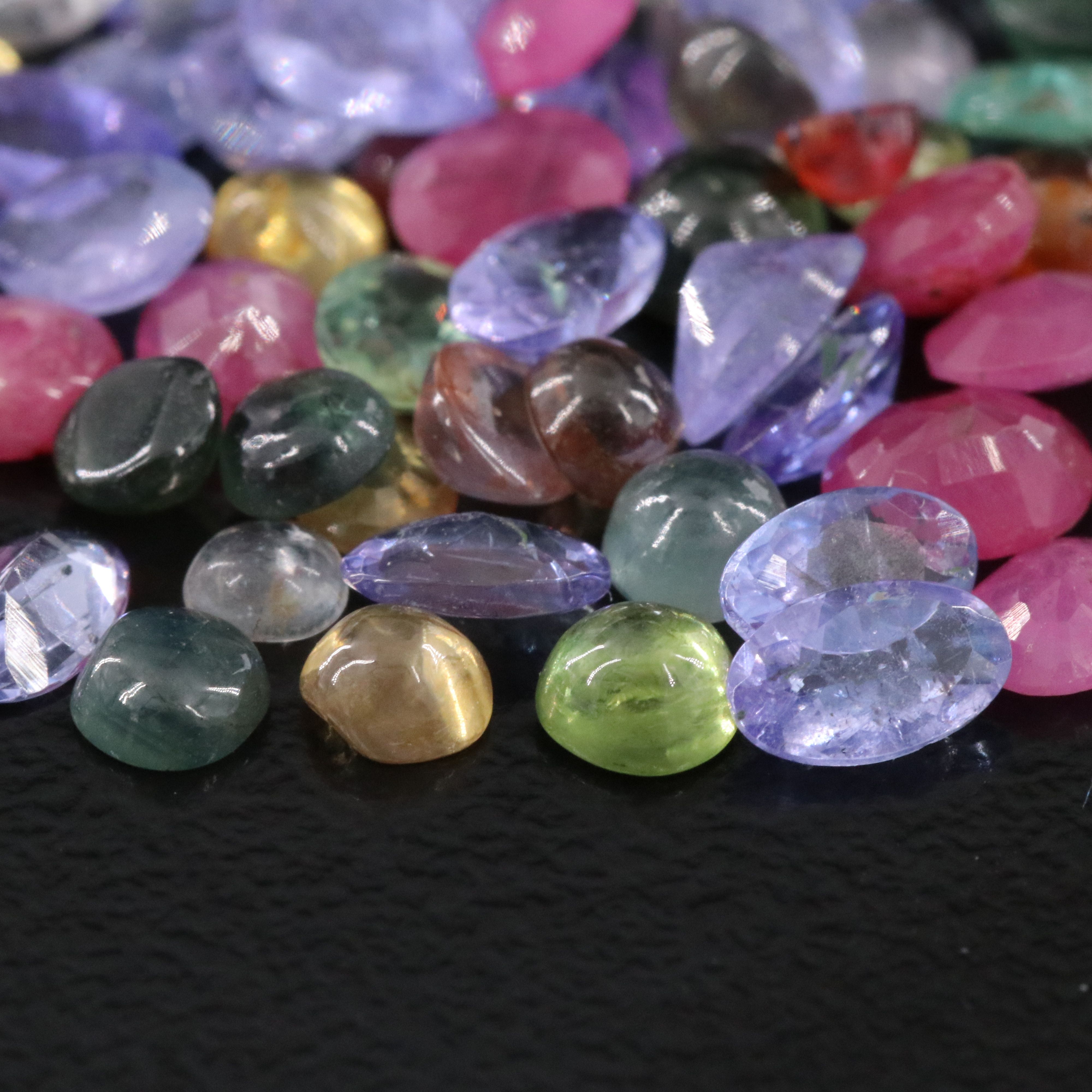 Loose 14.27 CTW Gemstone Lot Including Sapphire, Tanzanite and Ruby