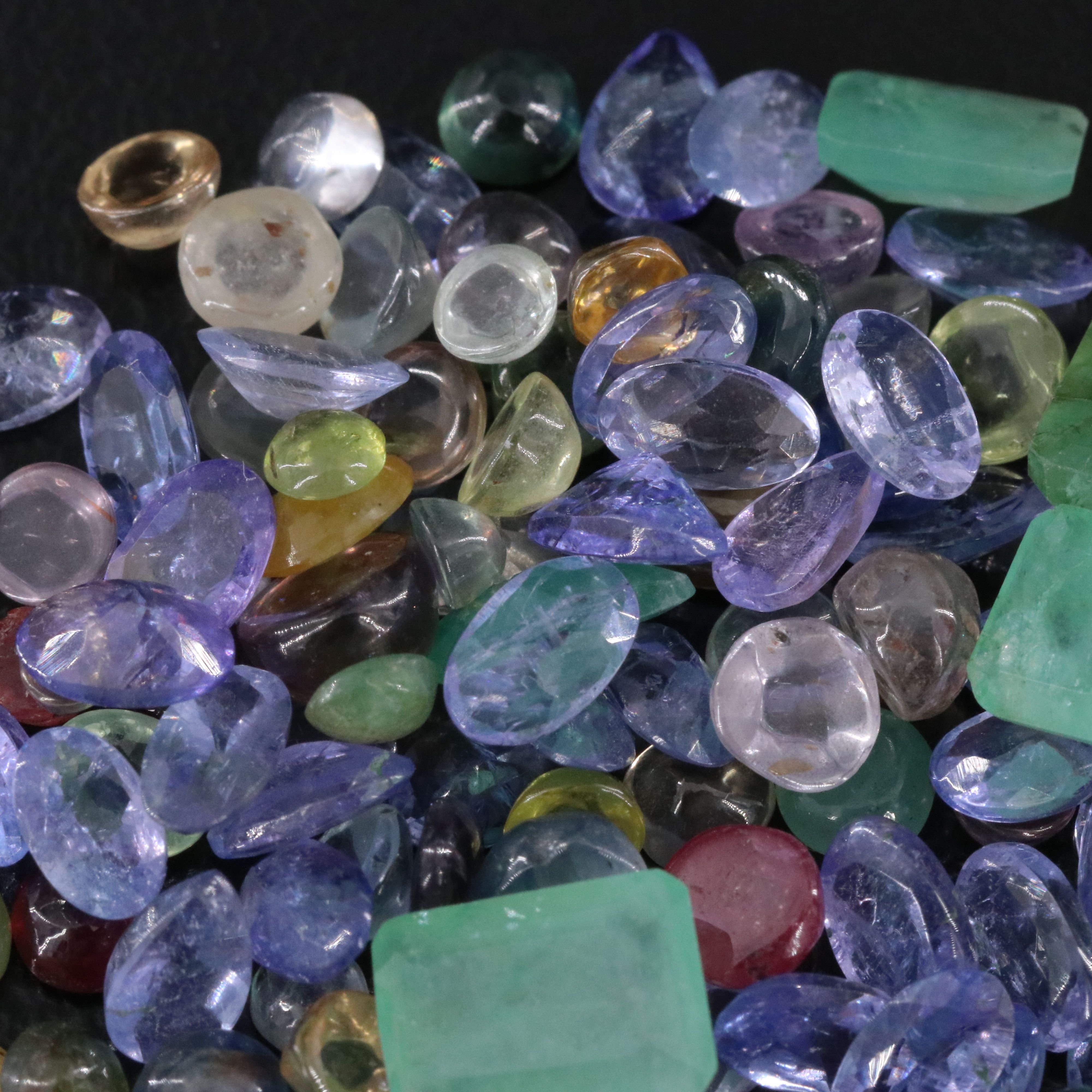 Loose 33.29 CTW Gemstone Lot Including Tanzanite, Emerald and Ruby
