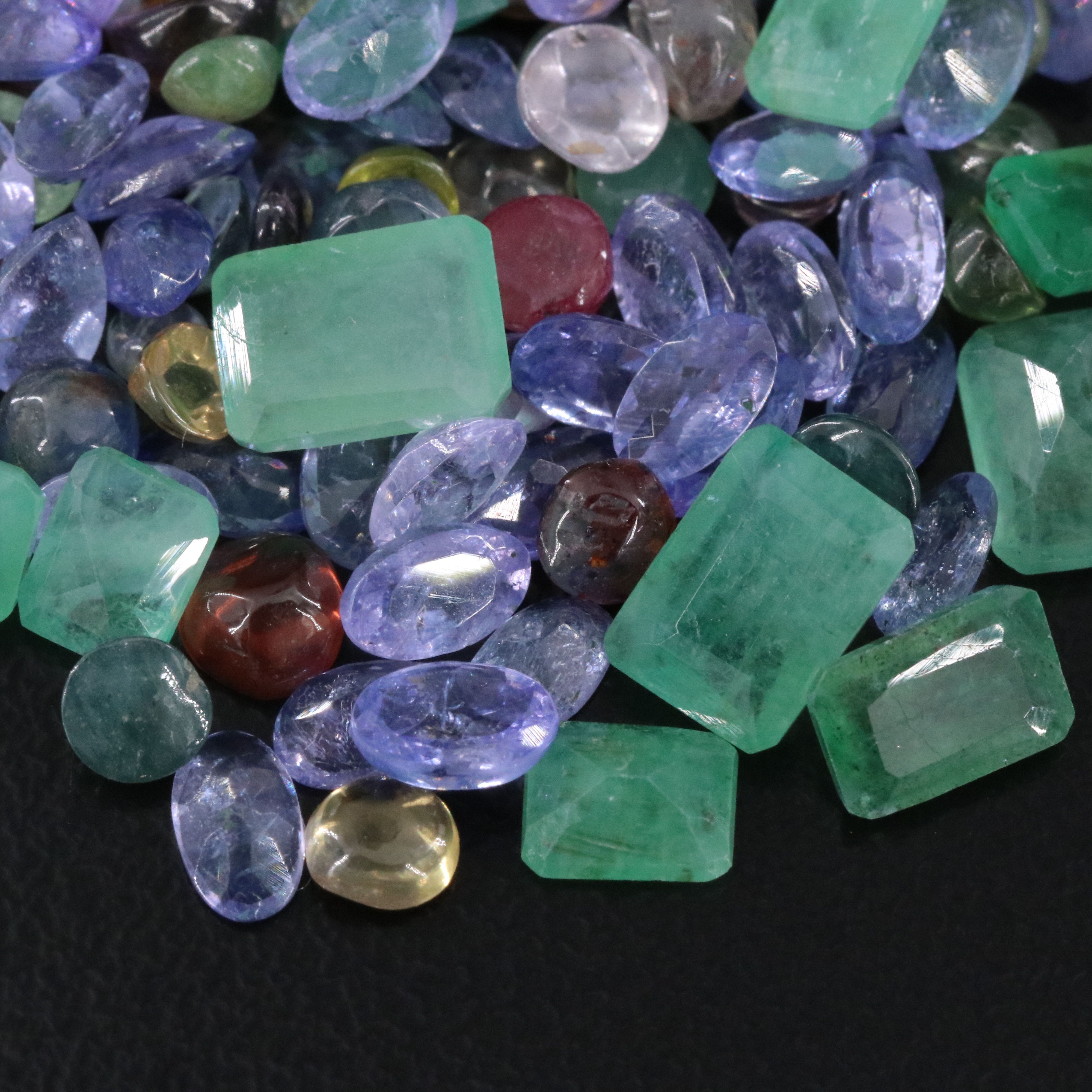 Loose 33.29 CTW Gemstone Lot Including Tanzanite, Emerald and Ruby
