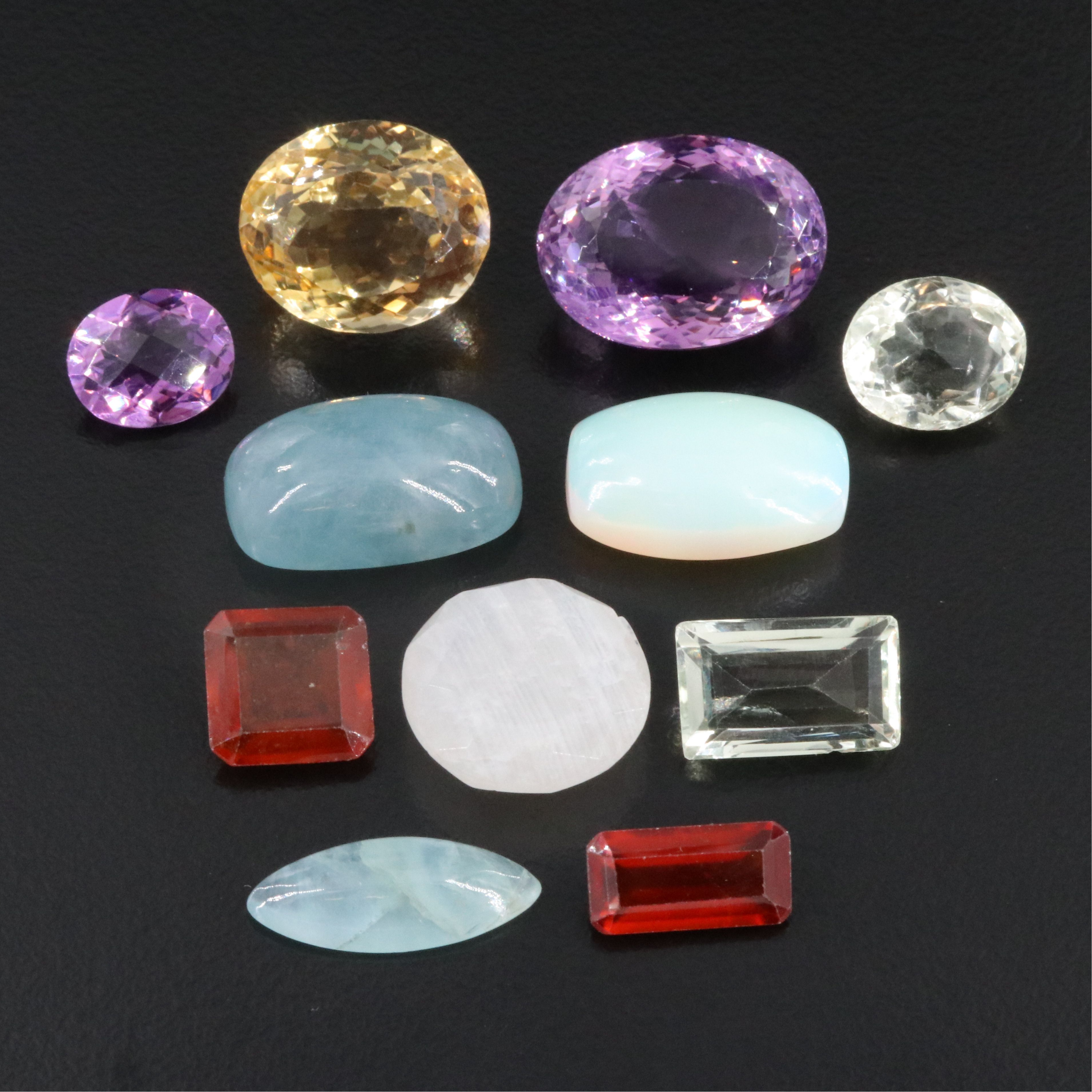 Loose 99.38 CTW Gemstone Lot Including Amethyst, Citrine and Hessonite Garnet