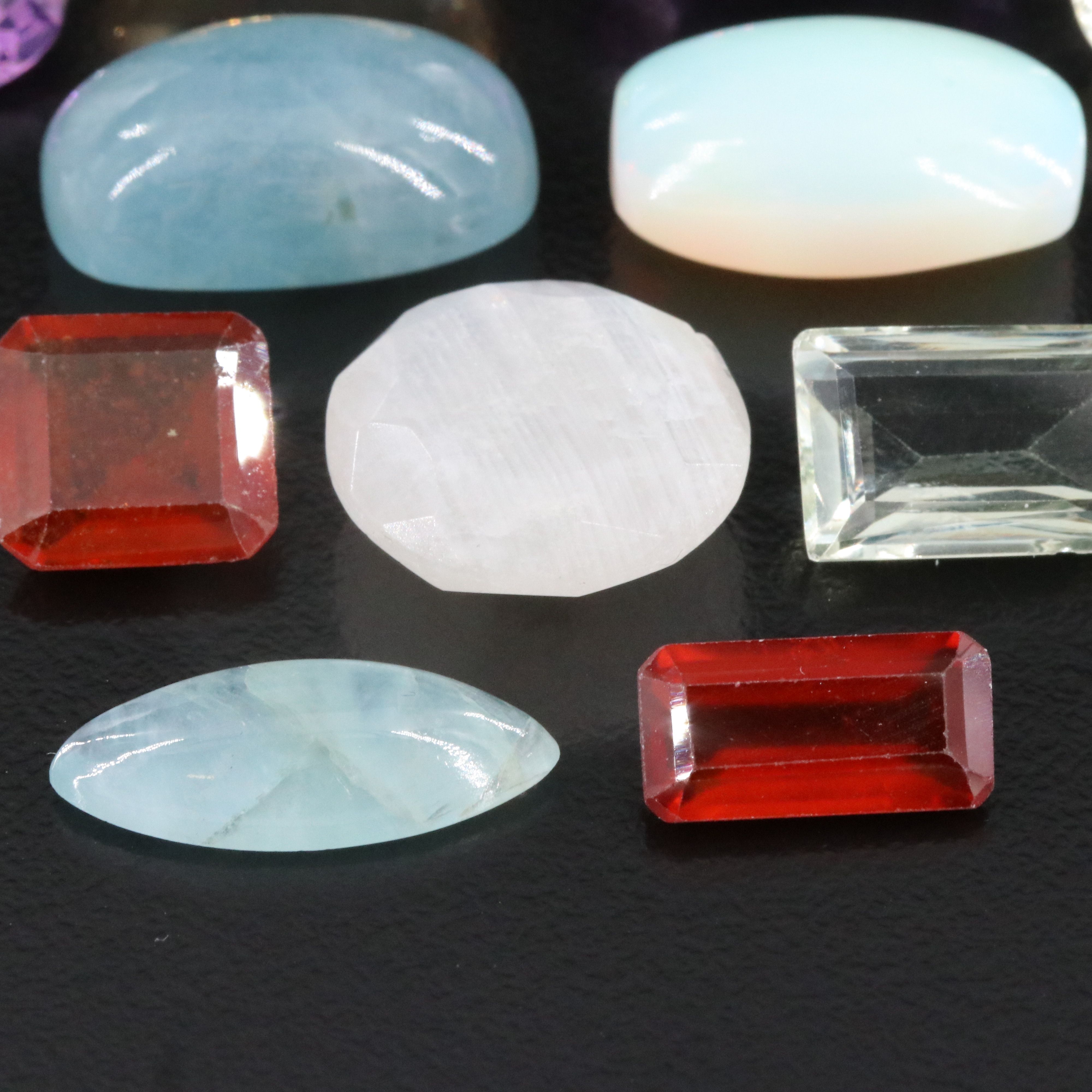 Loose 99.38 CTW Gemstone Lot Including Amethyst, Citrine and Hessonite Garnet