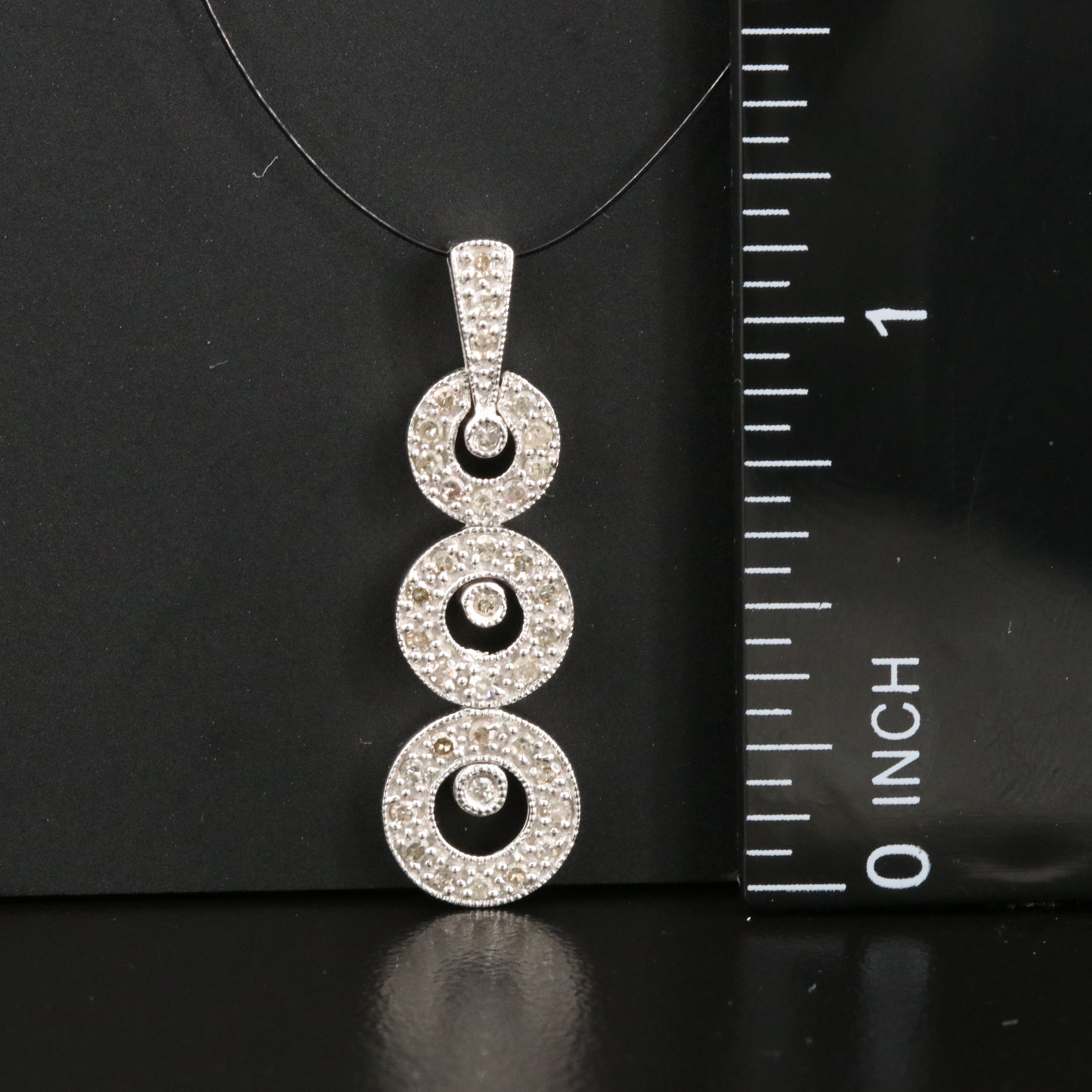 10K 0.26 CTW Diamond Graduated Circle Pendant