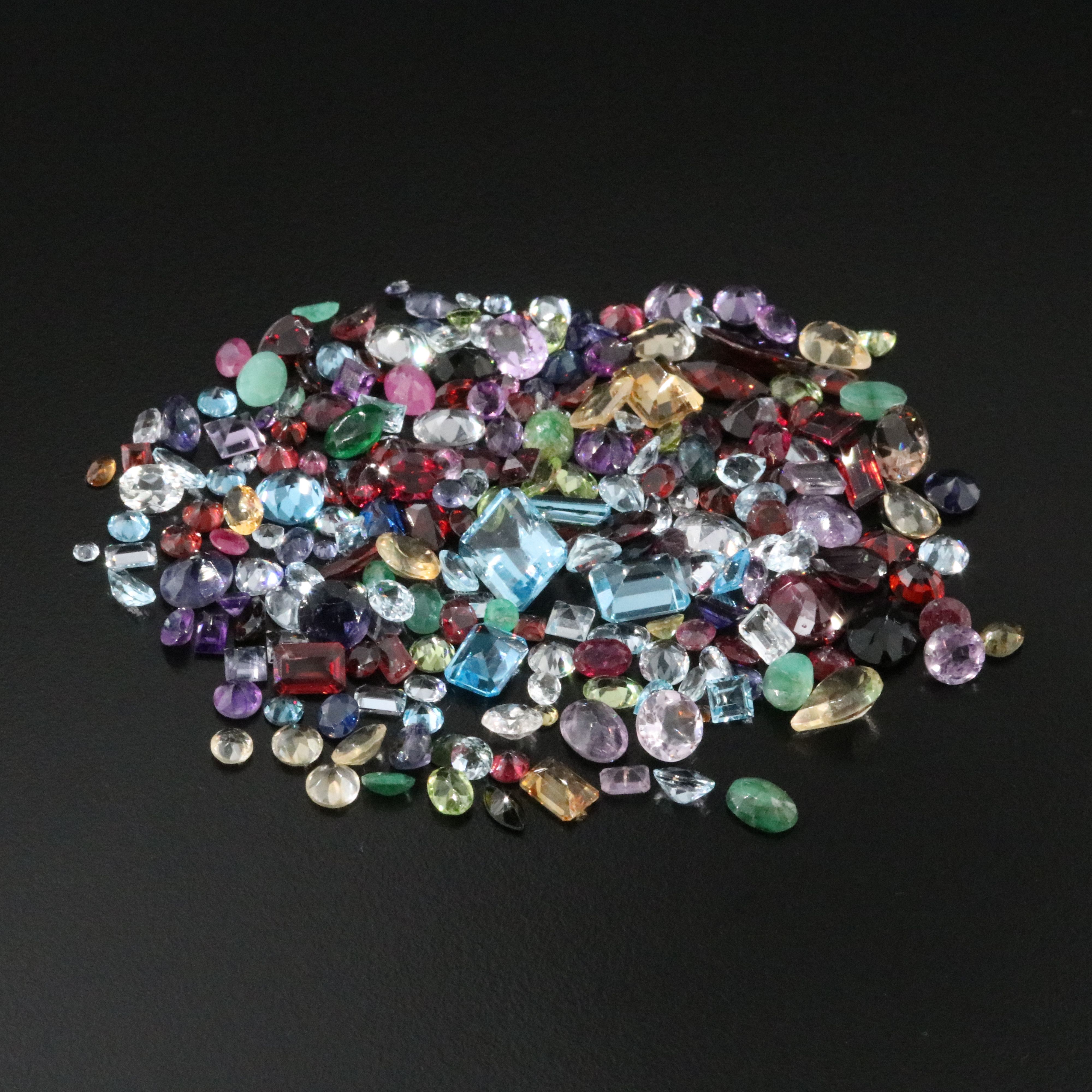 Loose 120.86 CTW Gemstones Featuring Emeralds, Aquamarines and Amethysts.