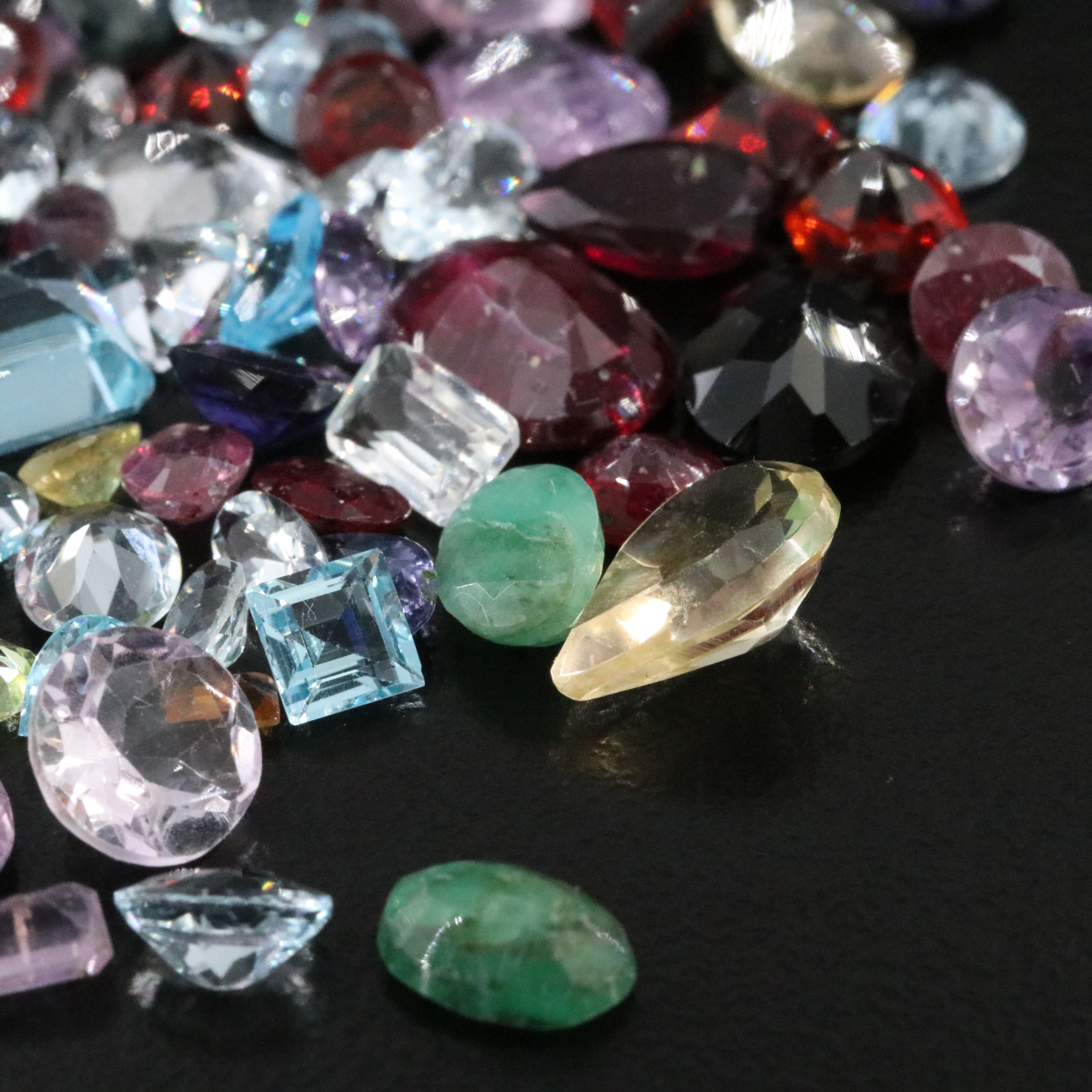 Loose 120.86 CTW Gemstones Featuring Emeralds, Aquamarines and Amethysts.