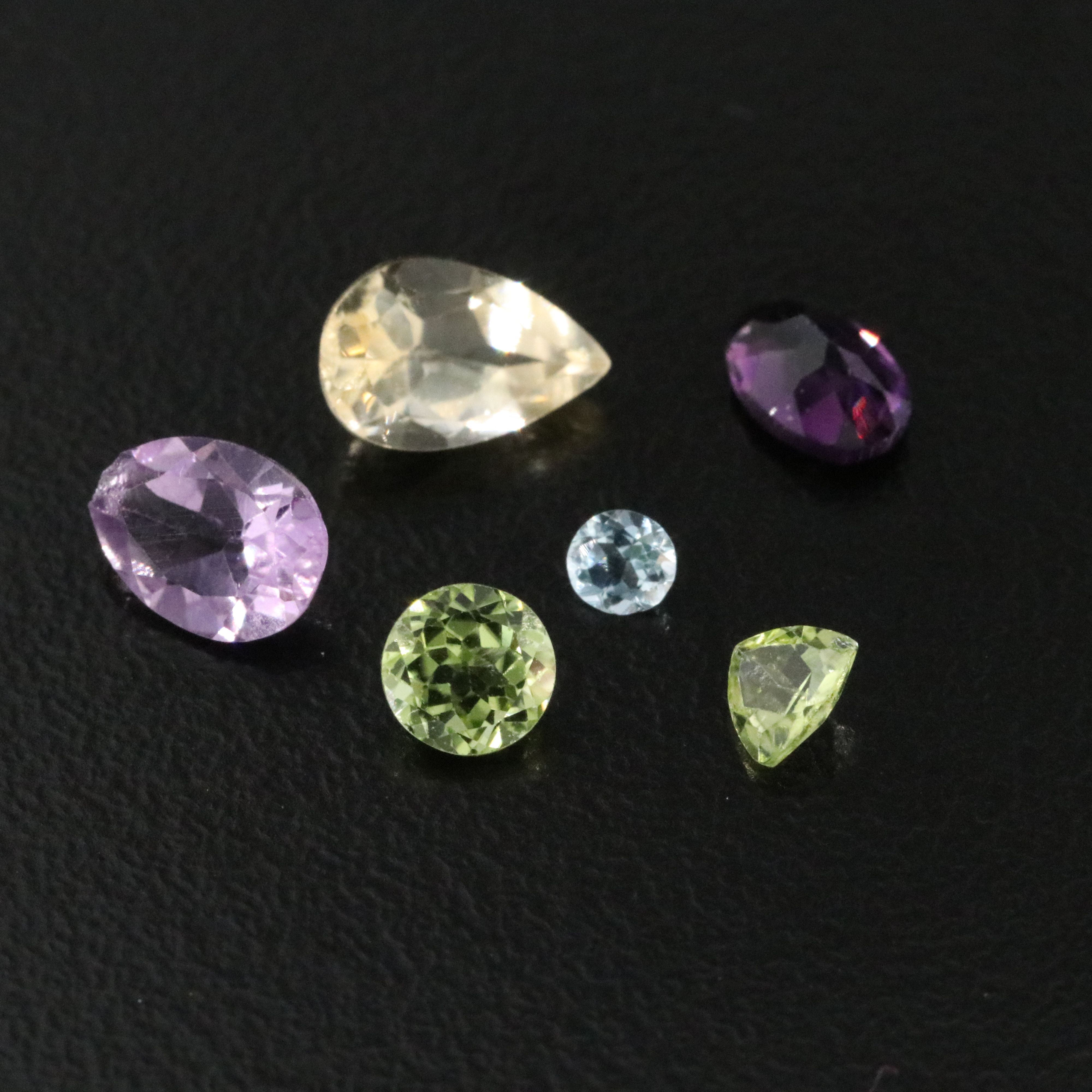Loose 120.86 CTW Gemstones Featuring Emeralds, Aquamarines and Amethysts.
