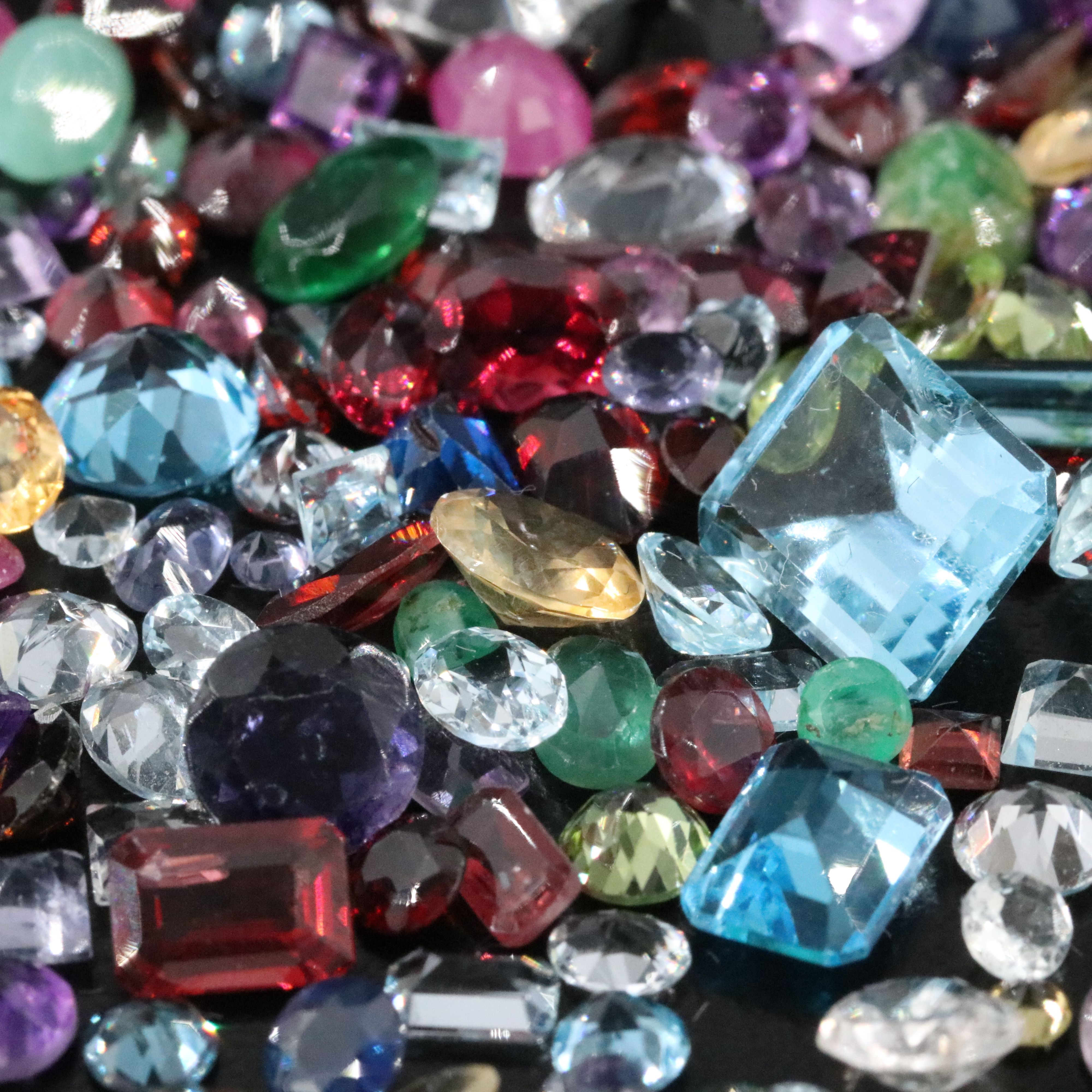 Loose 120.86 CTW Gemstones Featuring Emeralds, Aquamarines and Amethysts.