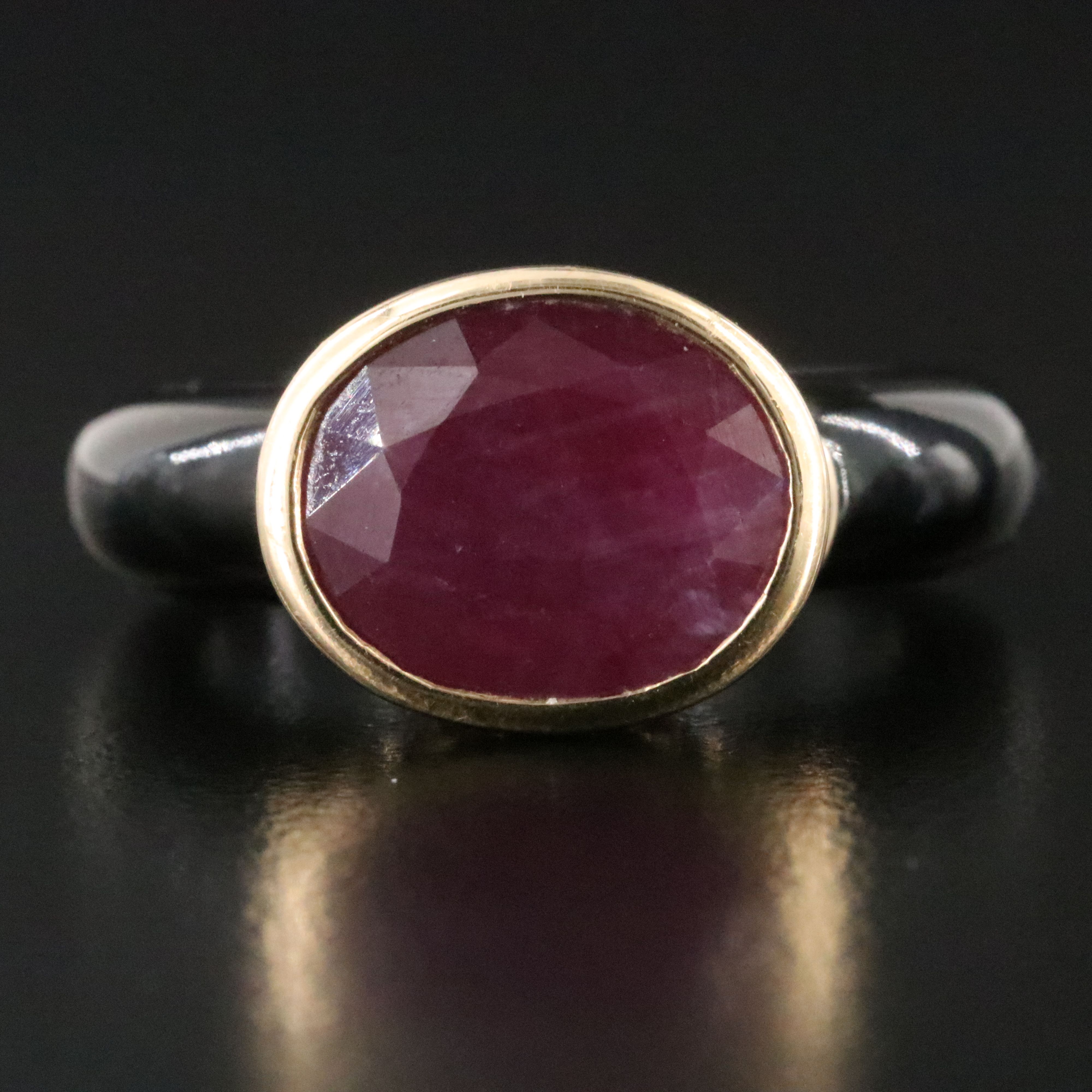 Black Onyx Hololith Ring with a 10K Bezel Set Ruby