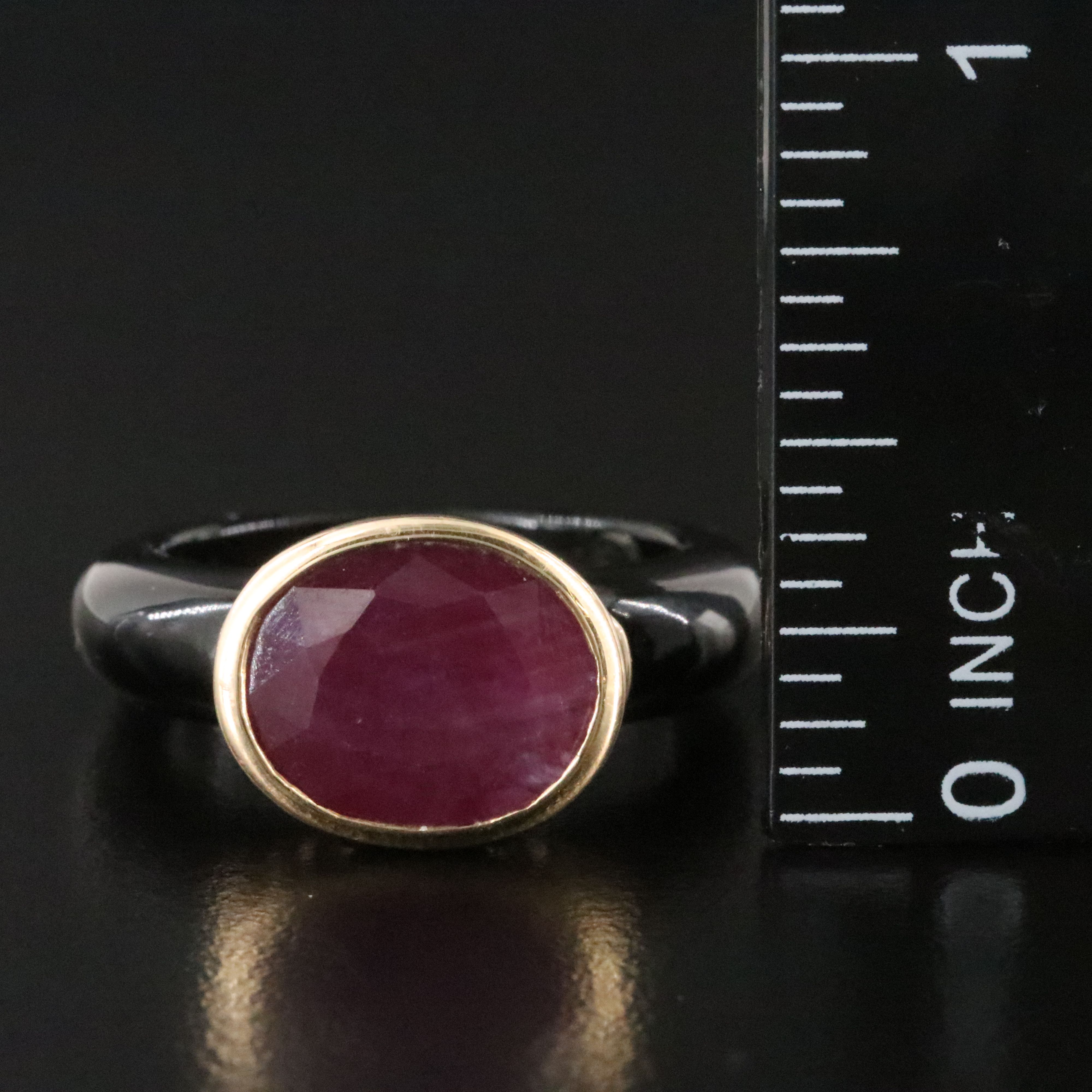 Black Onyx Hololith Ring with a 10K Bezel Set Ruby