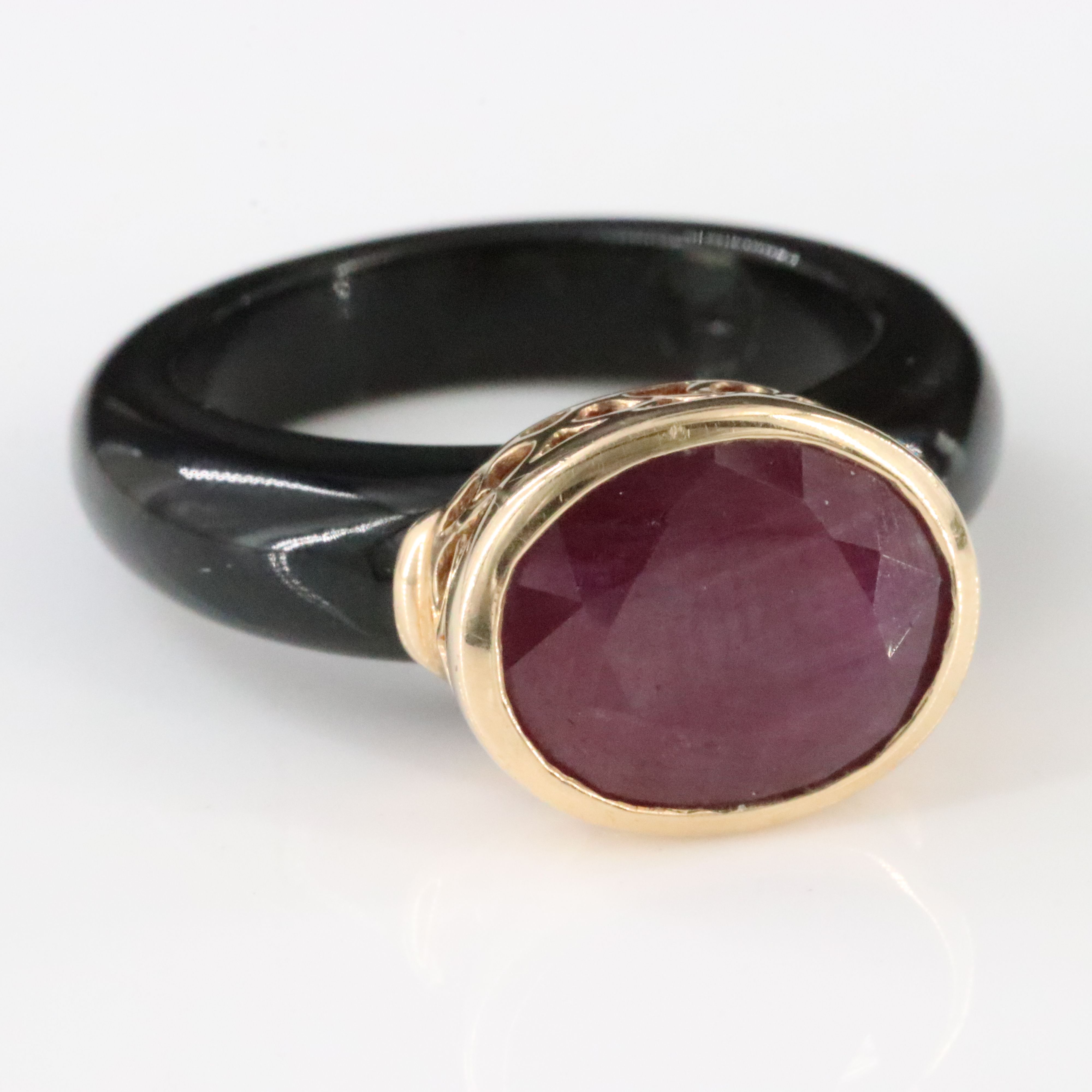 Black Onyx Hololith Ring with a 10K Bezel Set Ruby
