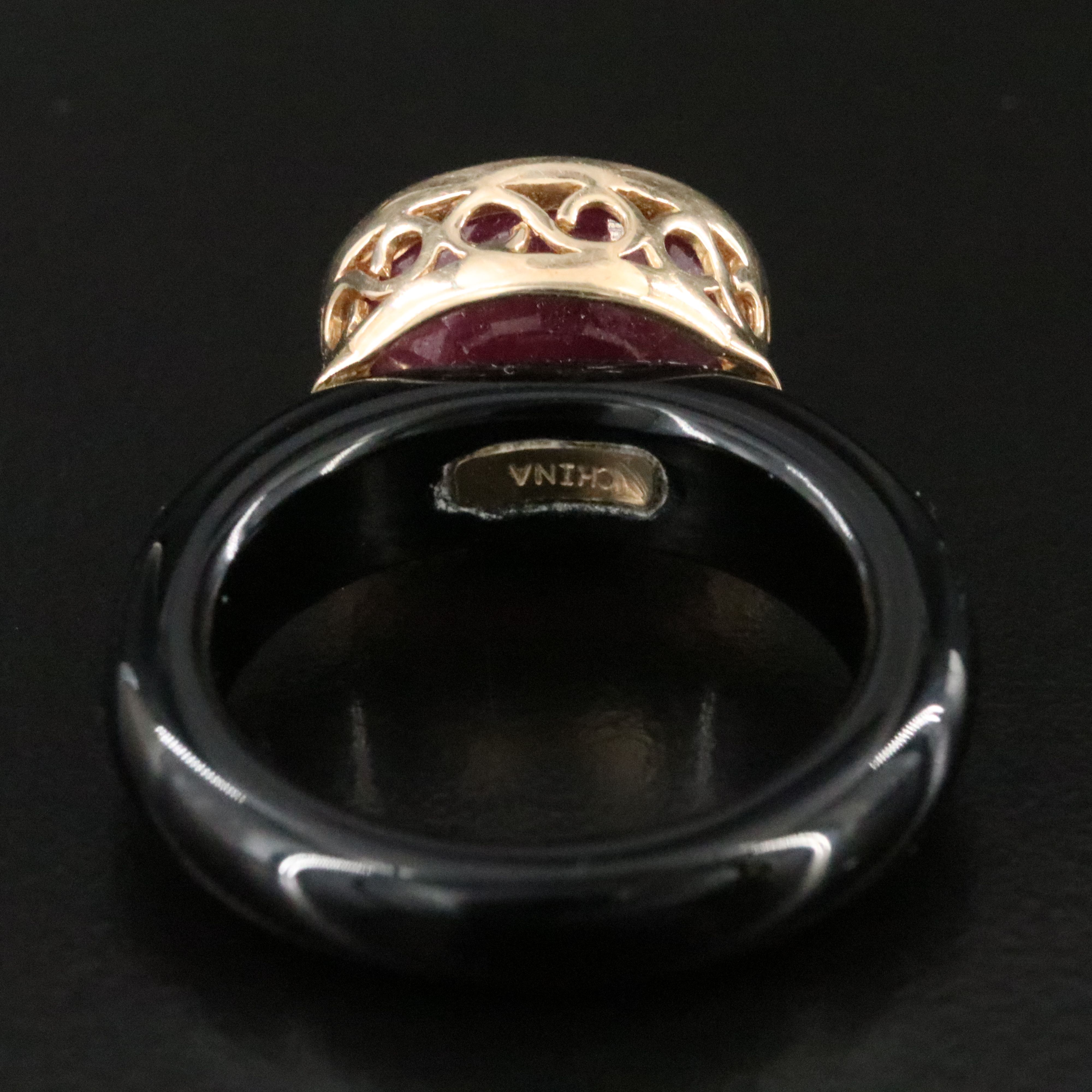 Black Onyx Hololith Ring with a 10K Bezel Set Ruby