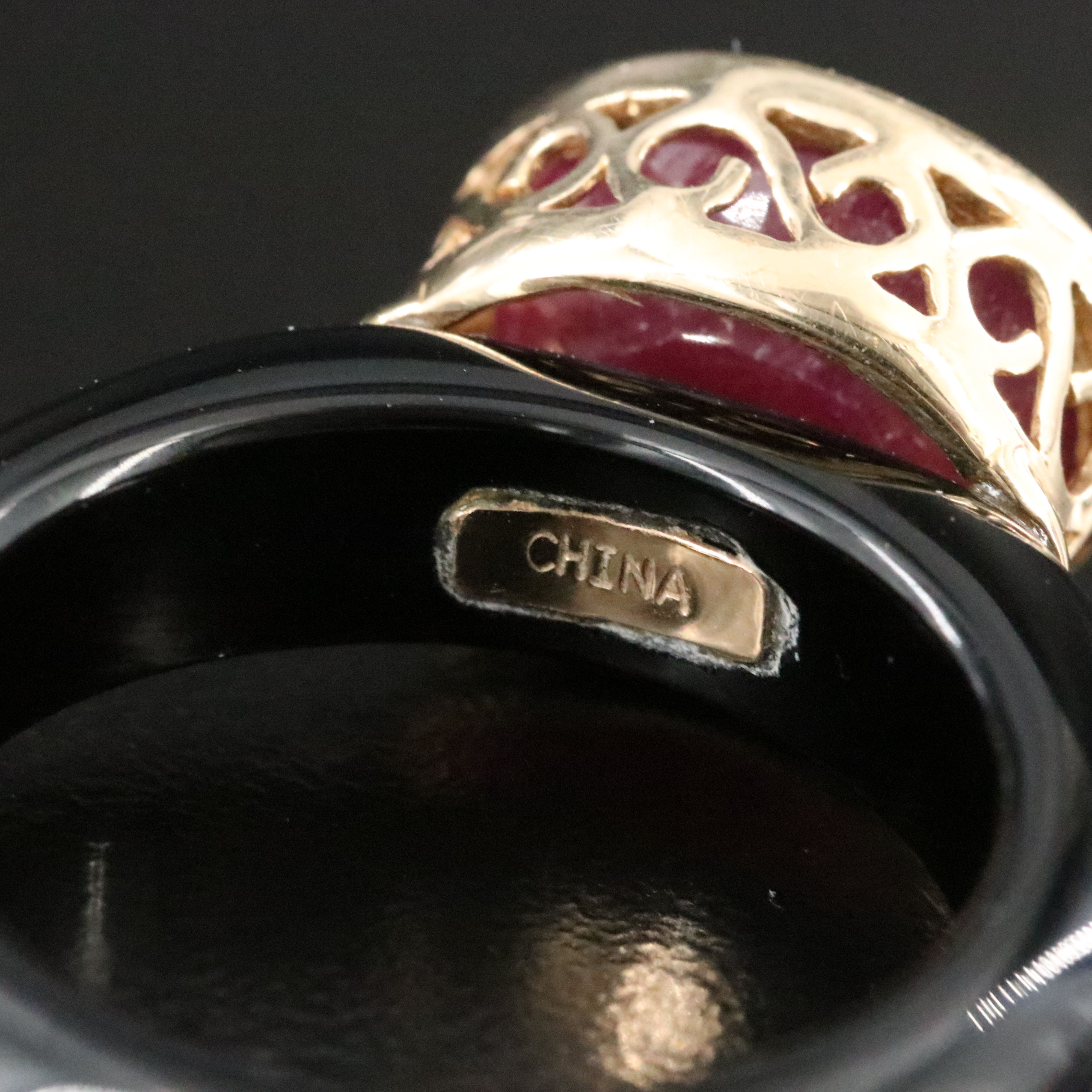 Black Onyx Hololith Ring with a 10K Bezel Set Ruby