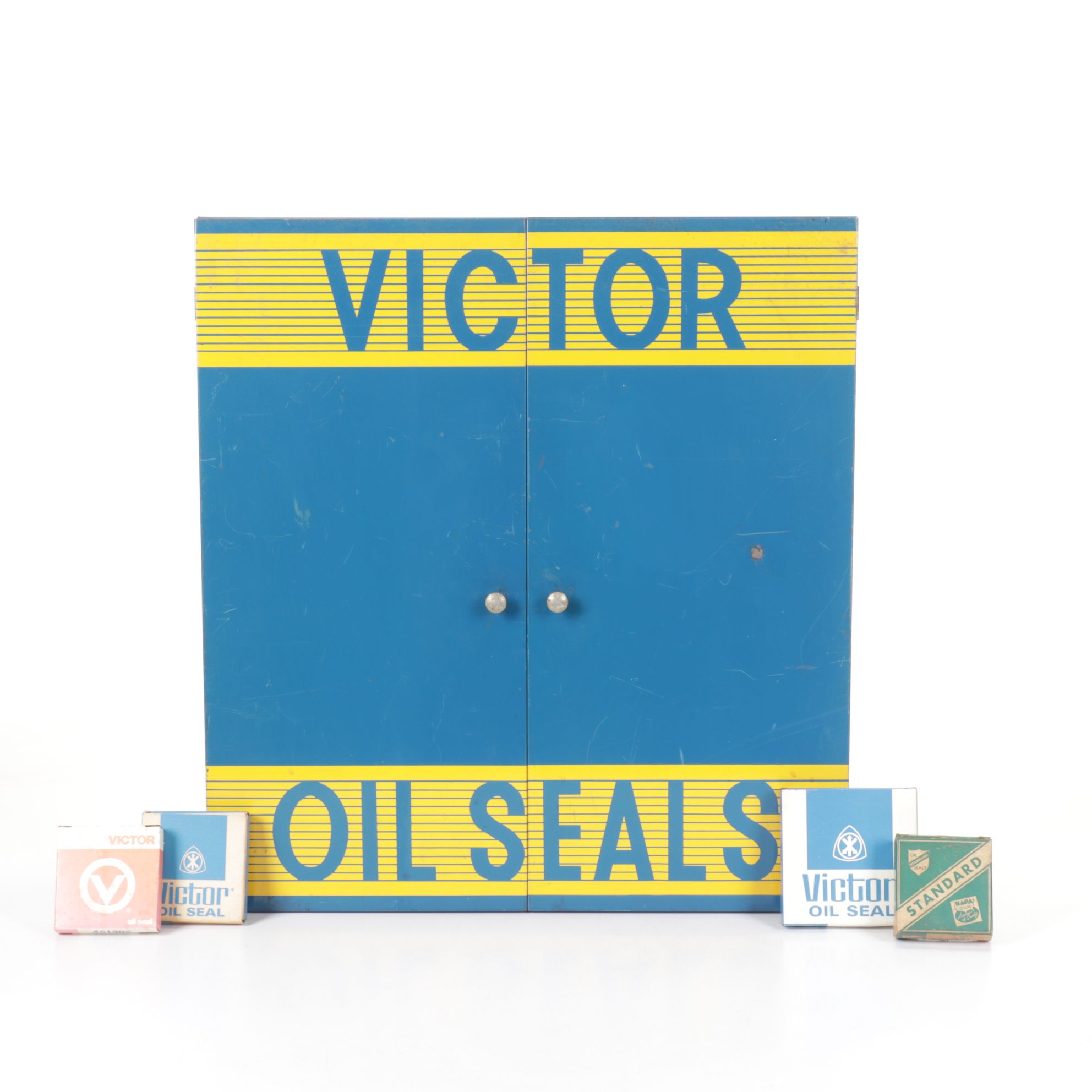 Victor Oil Seals Advertising Cabinet with Collection of Oil Seals, Mid-20th C.