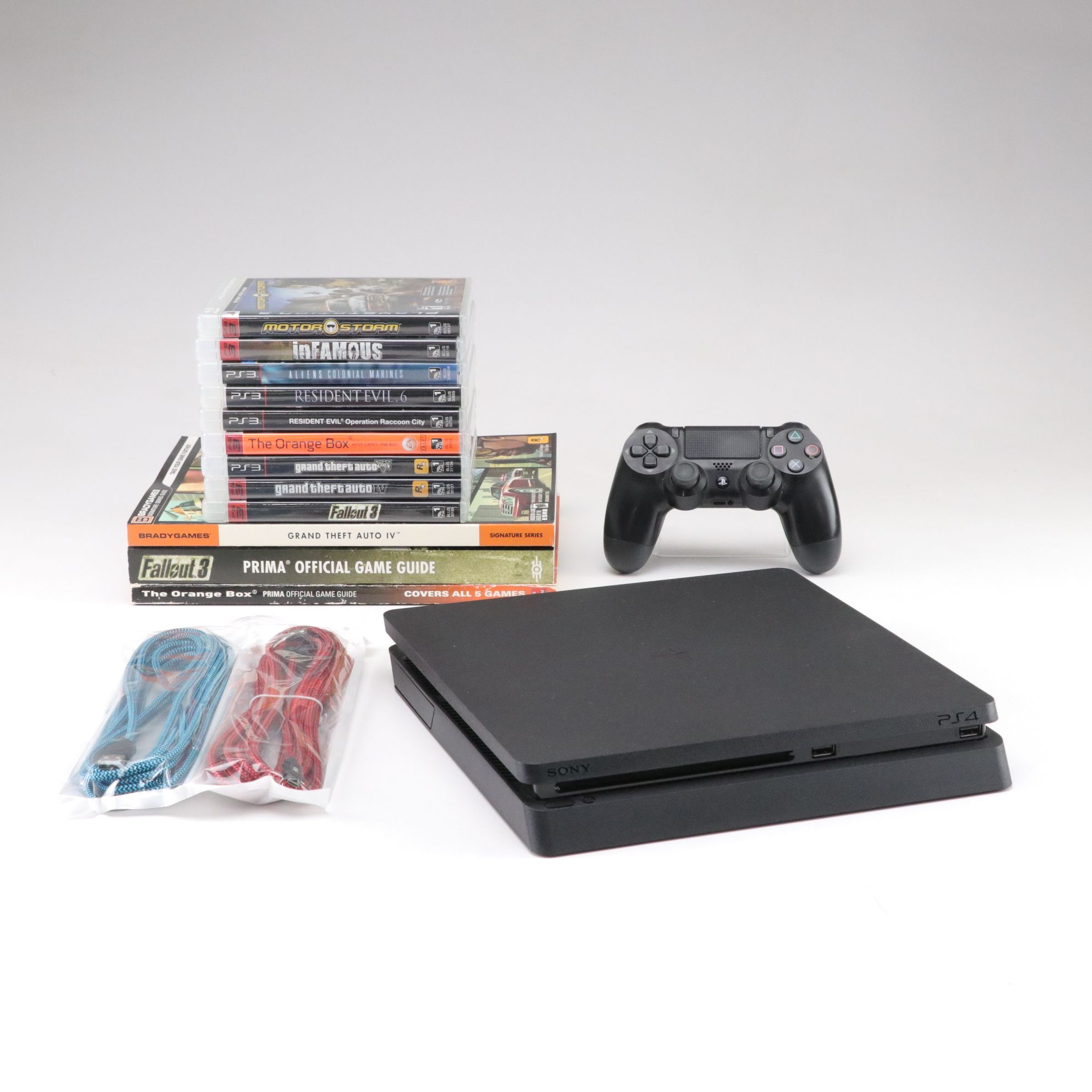 Sony PlayStation 4 Console with Video Games, Controller and Guide Books