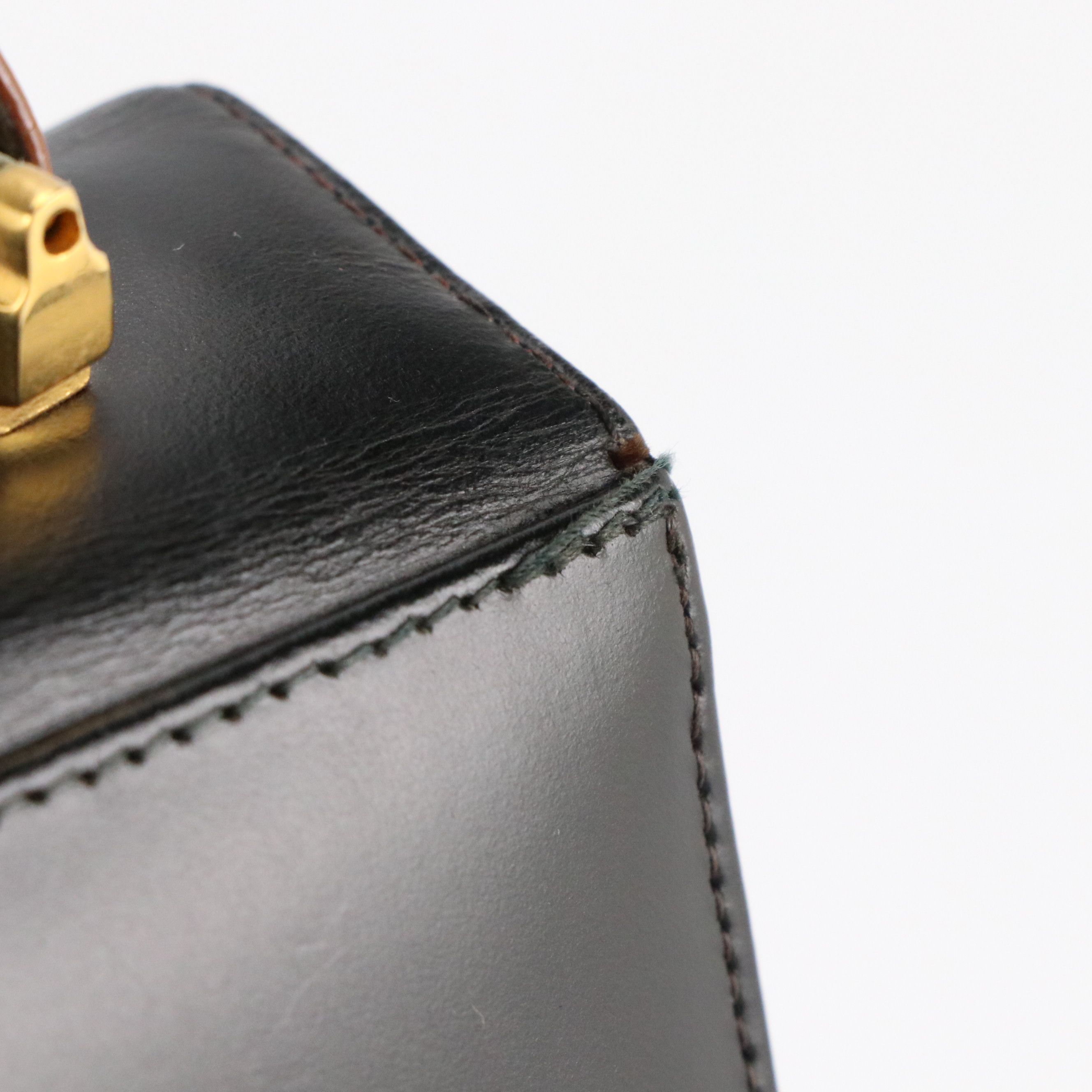 Palizzio Front Flap Accordion Top Handle Handbag in Black and Brown Leather