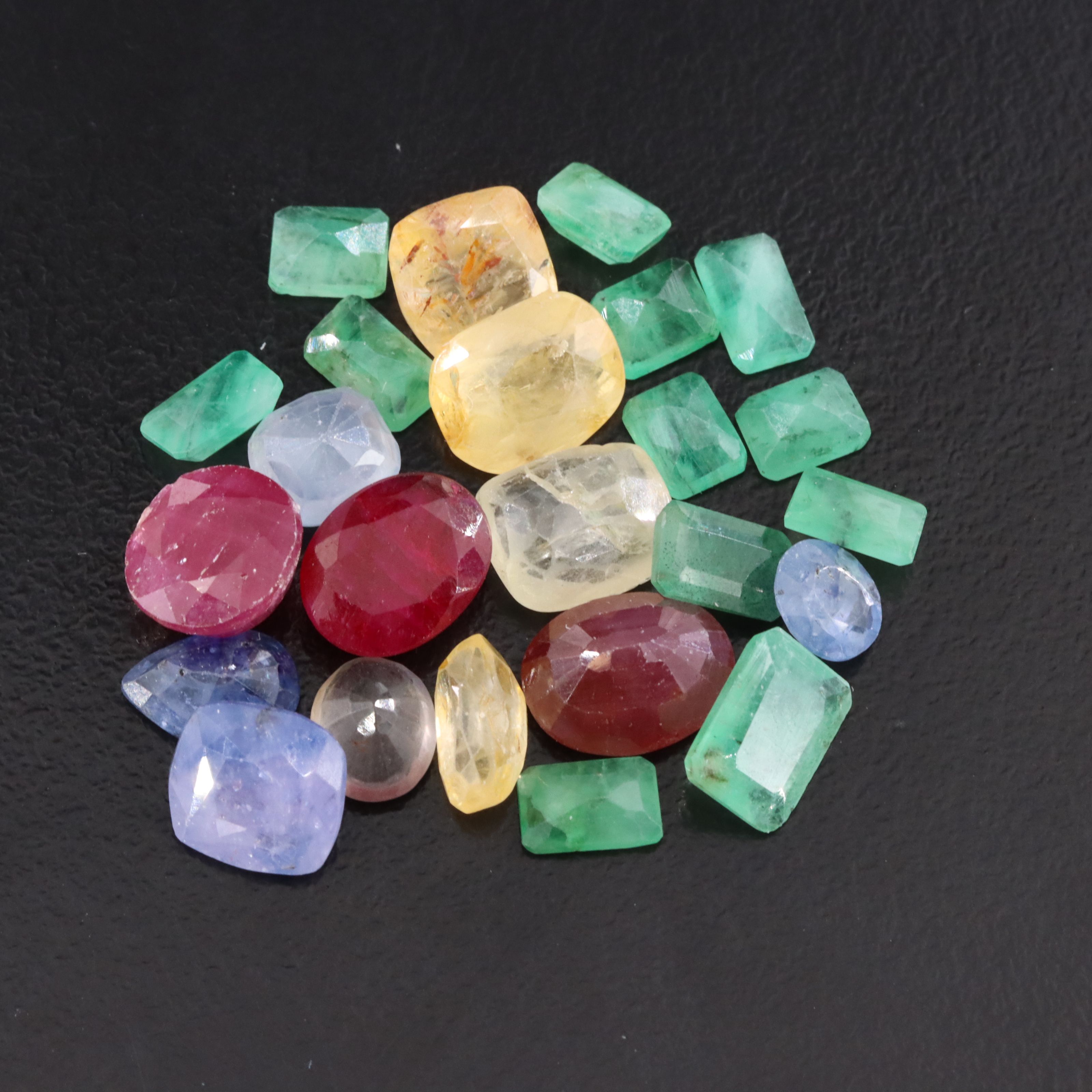 Loose 27.61 CTW Gemstone Lot Including Ruby, Sapphire and Emerald