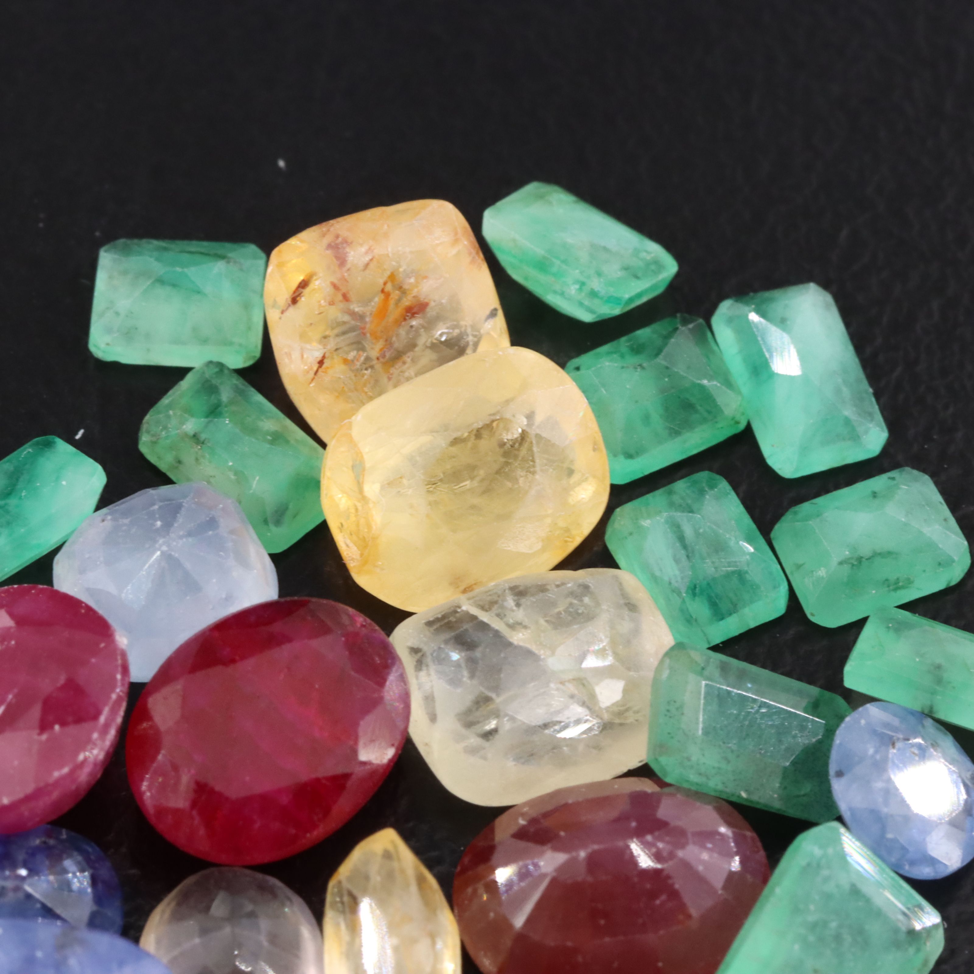 Loose 27.61 CTW Gemstone Lot Including Ruby, Sapphire and Emerald