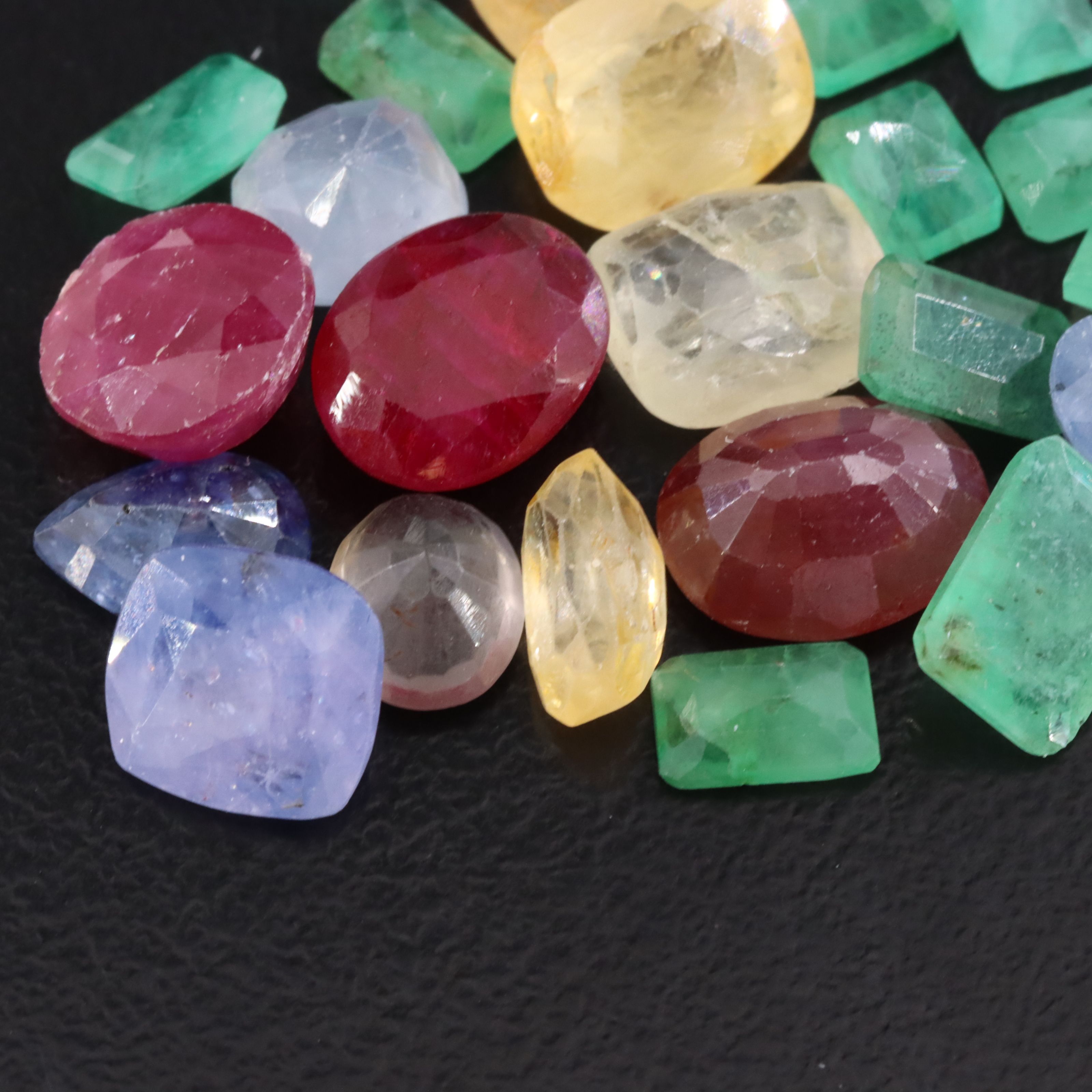 Loose 27.61 CTW Gemstone Lot Including Ruby, Sapphire and Emerald