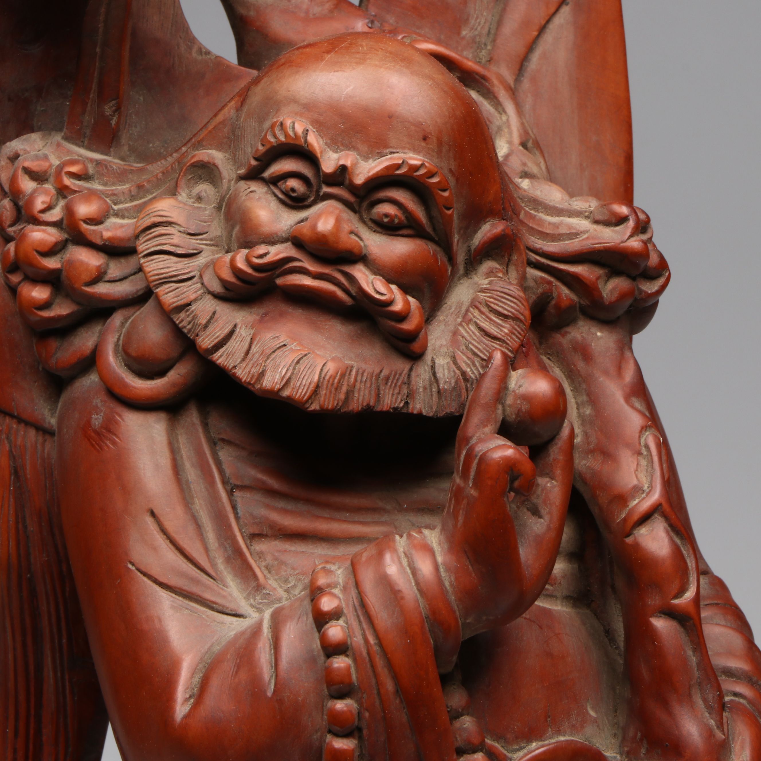 Chinese Carved Wood Deity with Guardian Lion