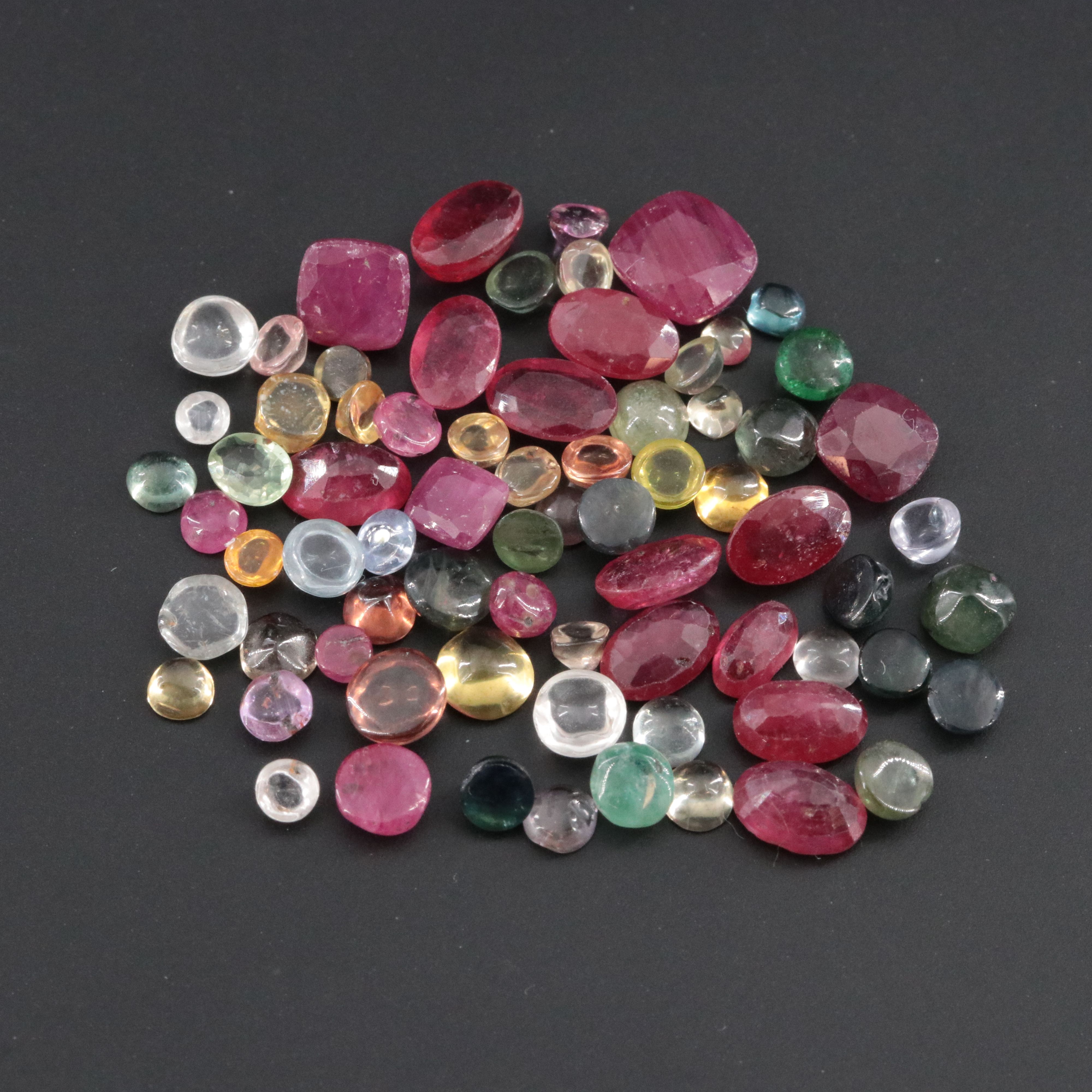 Loose 22.92 CTW Gemstone Lot Including Filled Corundum, Sapphire and Ruby
