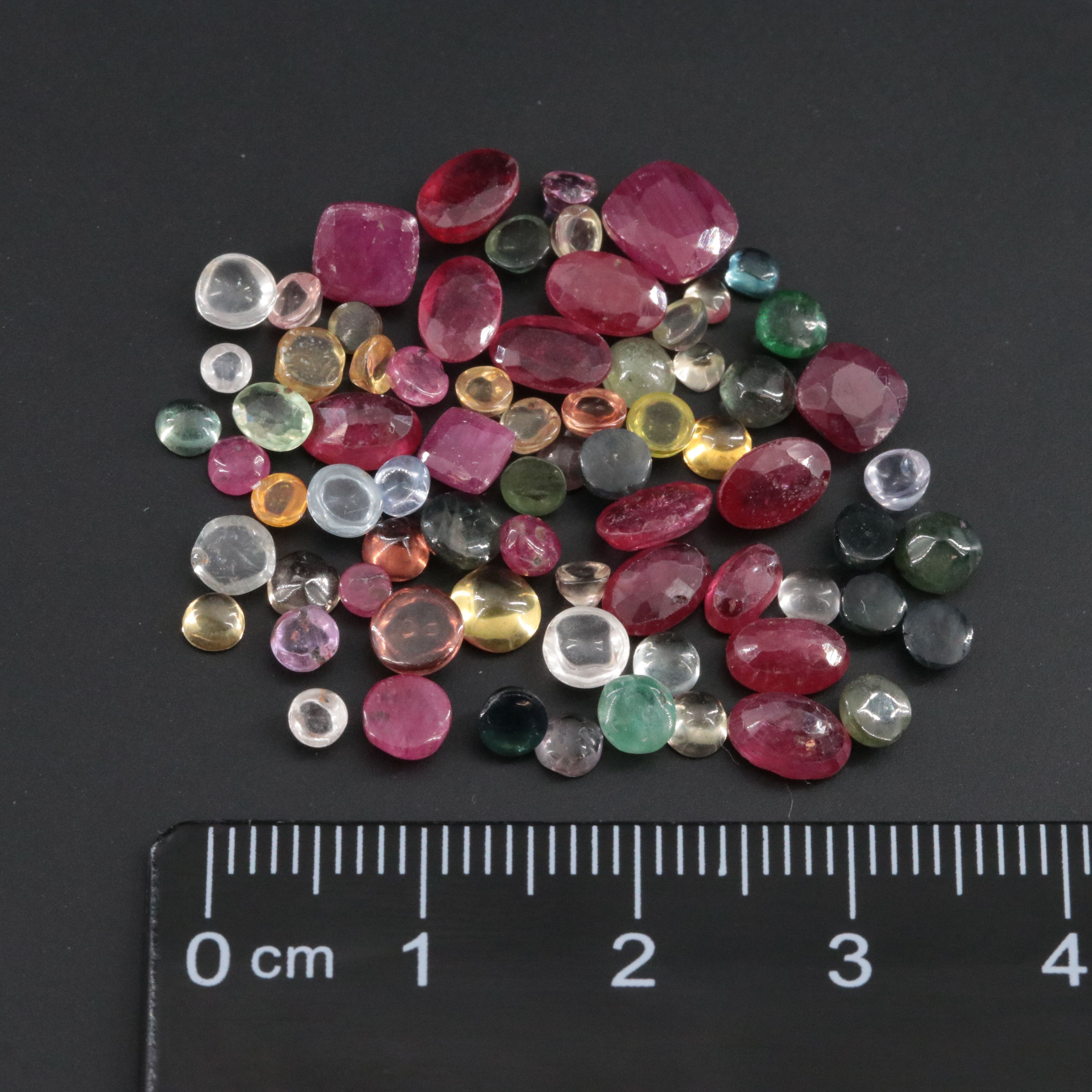 Loose 22.92 CTW Gemstone Lot Including Filled Corundum, Sapphire and Ruby