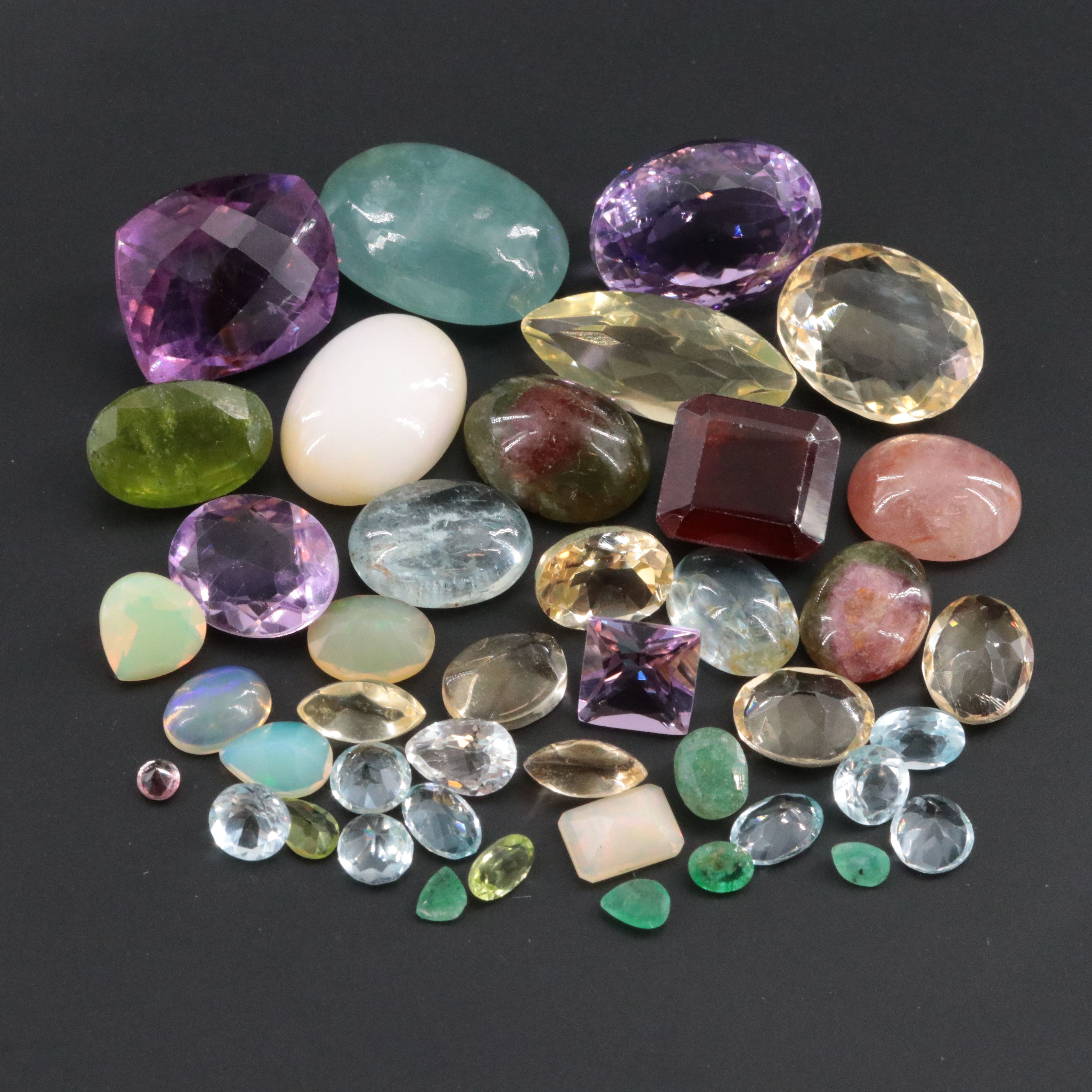 Loose 99.72 CTW Gemstone Lot Including Citrine, Amethyst and Hessonite