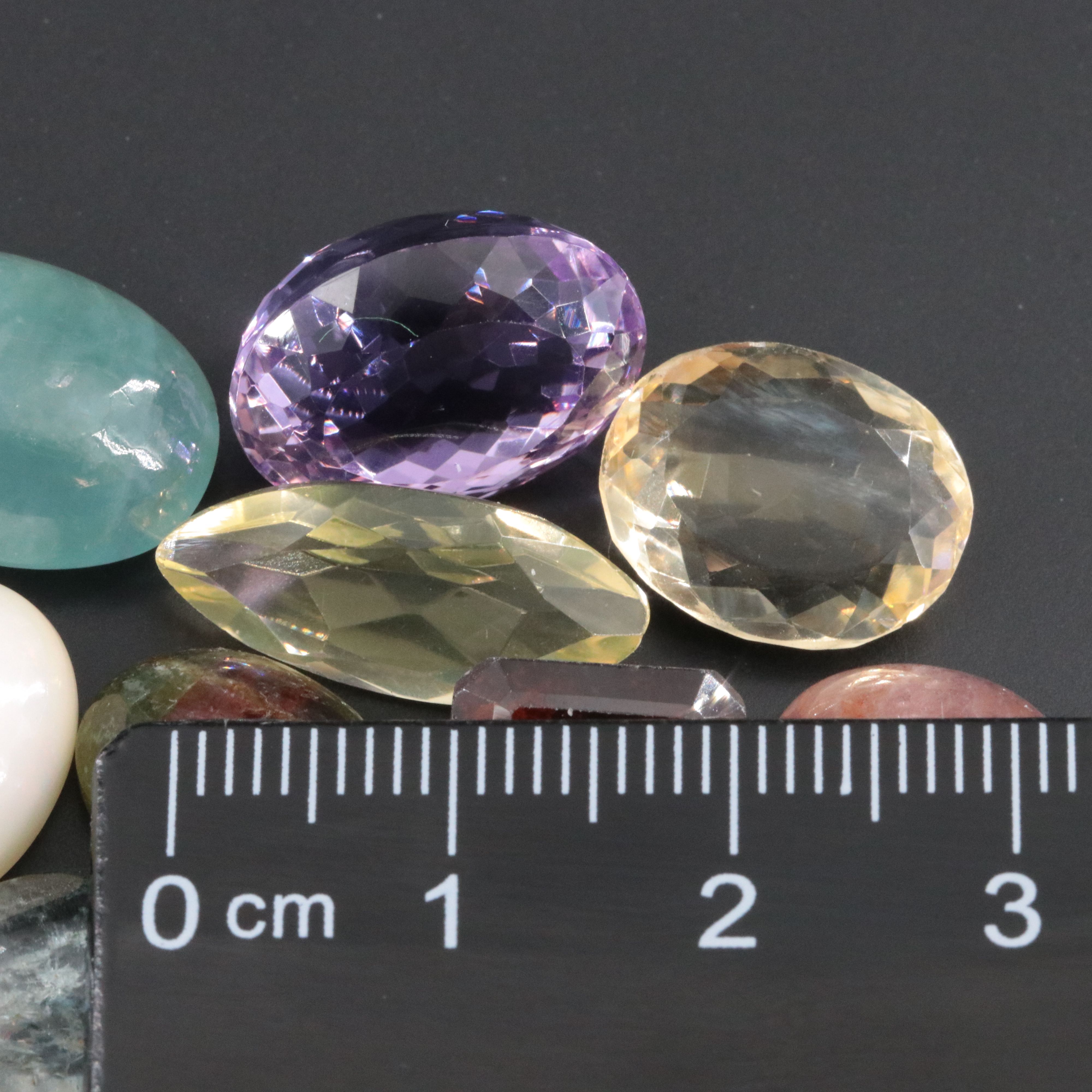 Loose 99.72 CTW Gemstone Lot Including Citrine, Amethyst and Hessonite