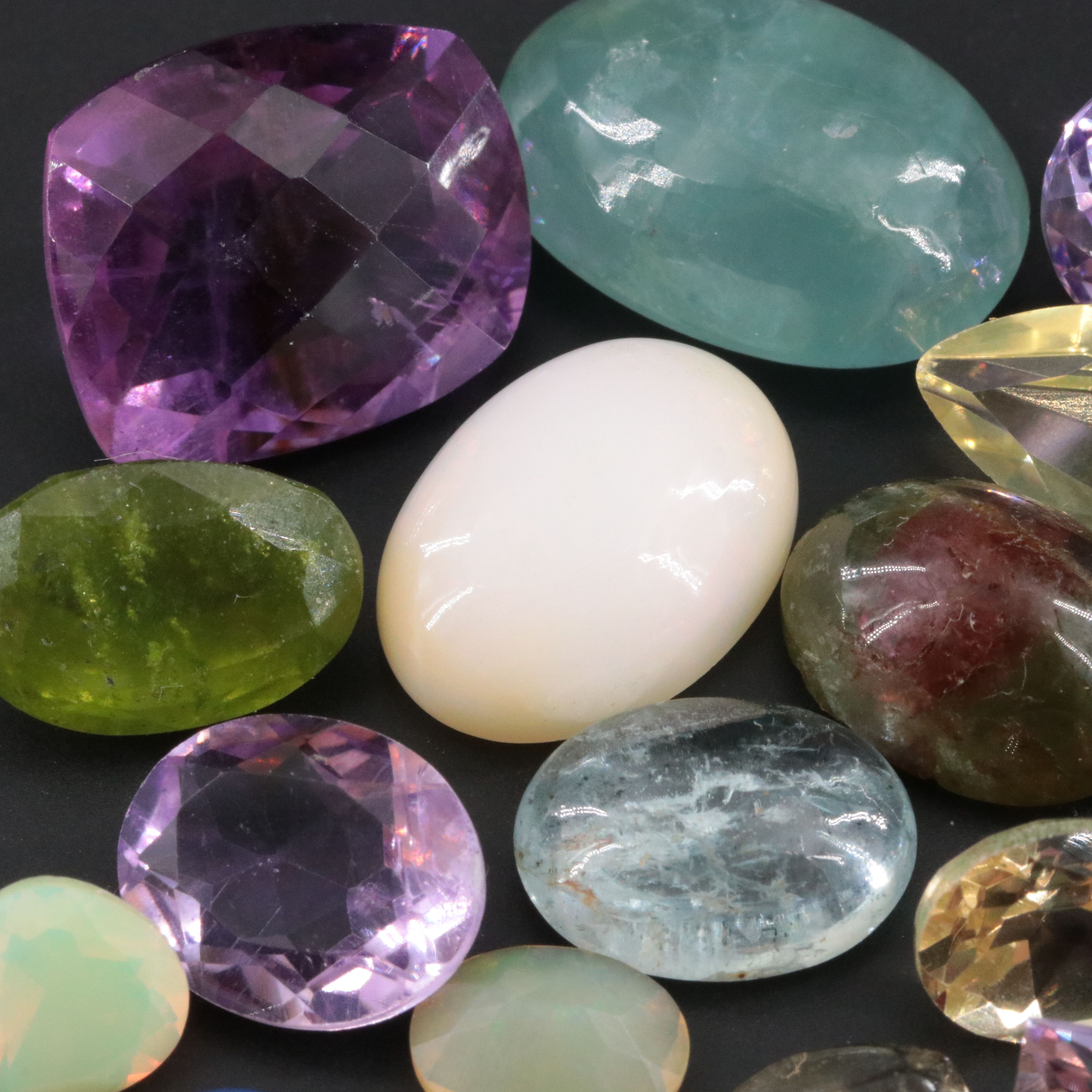 Loose 99.72 CTW Gemstone Lot Including Citrine, Amethyst and Hessonite