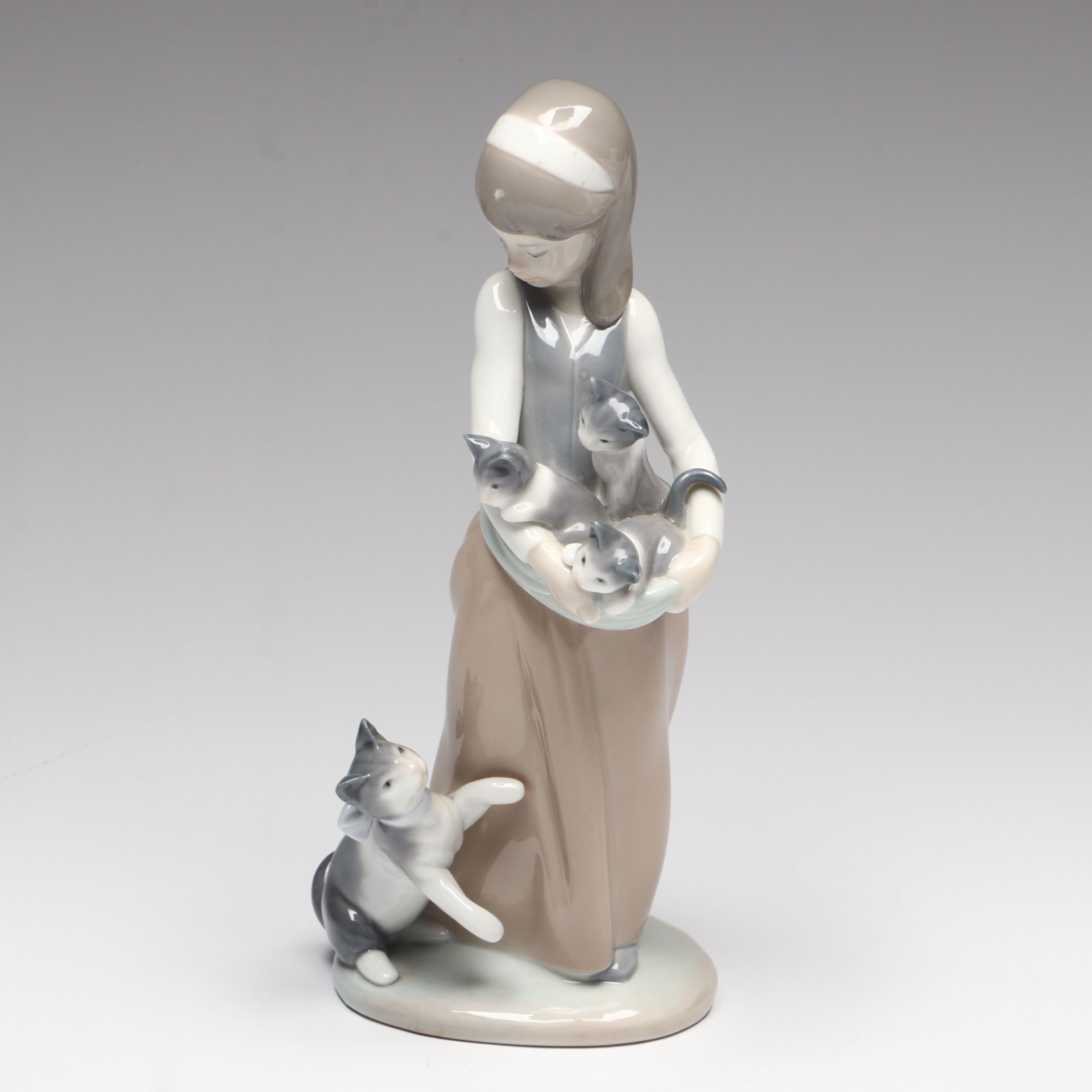 Lladró "Following Her Cats" Porcelain Figurine and Annual Porcelain Bells