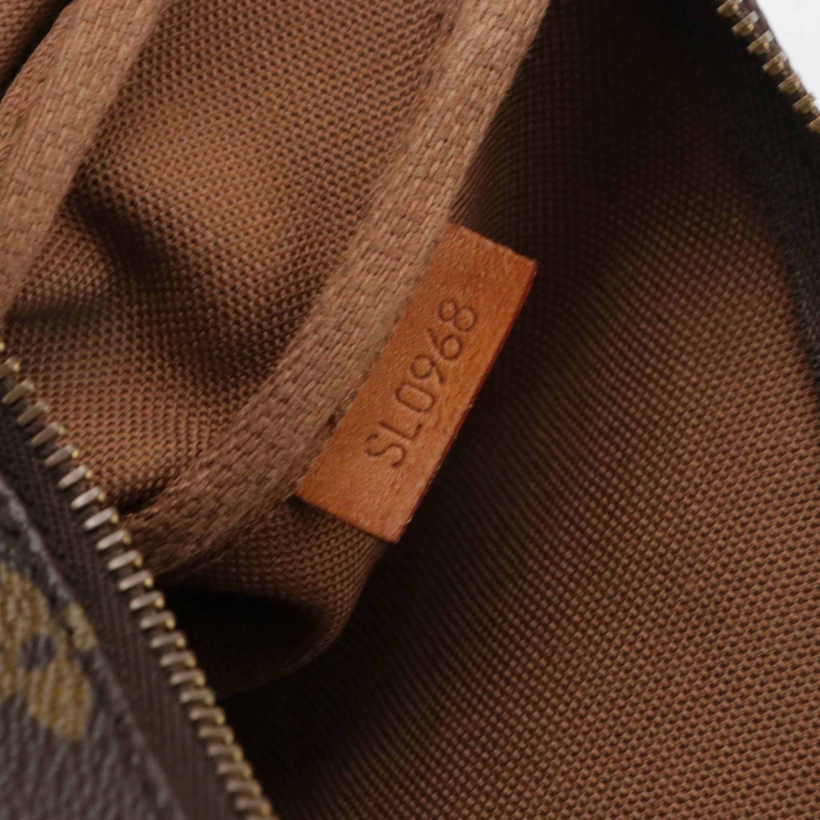 Louis Vuitton Pochette Accessoires in Monogram Canvas and Vachetta Leather